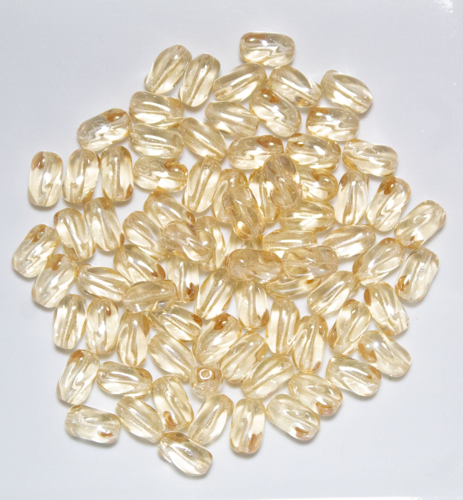 25 9mm x 6mm Crystal Champagne Czech glass twisted oval beads C0001