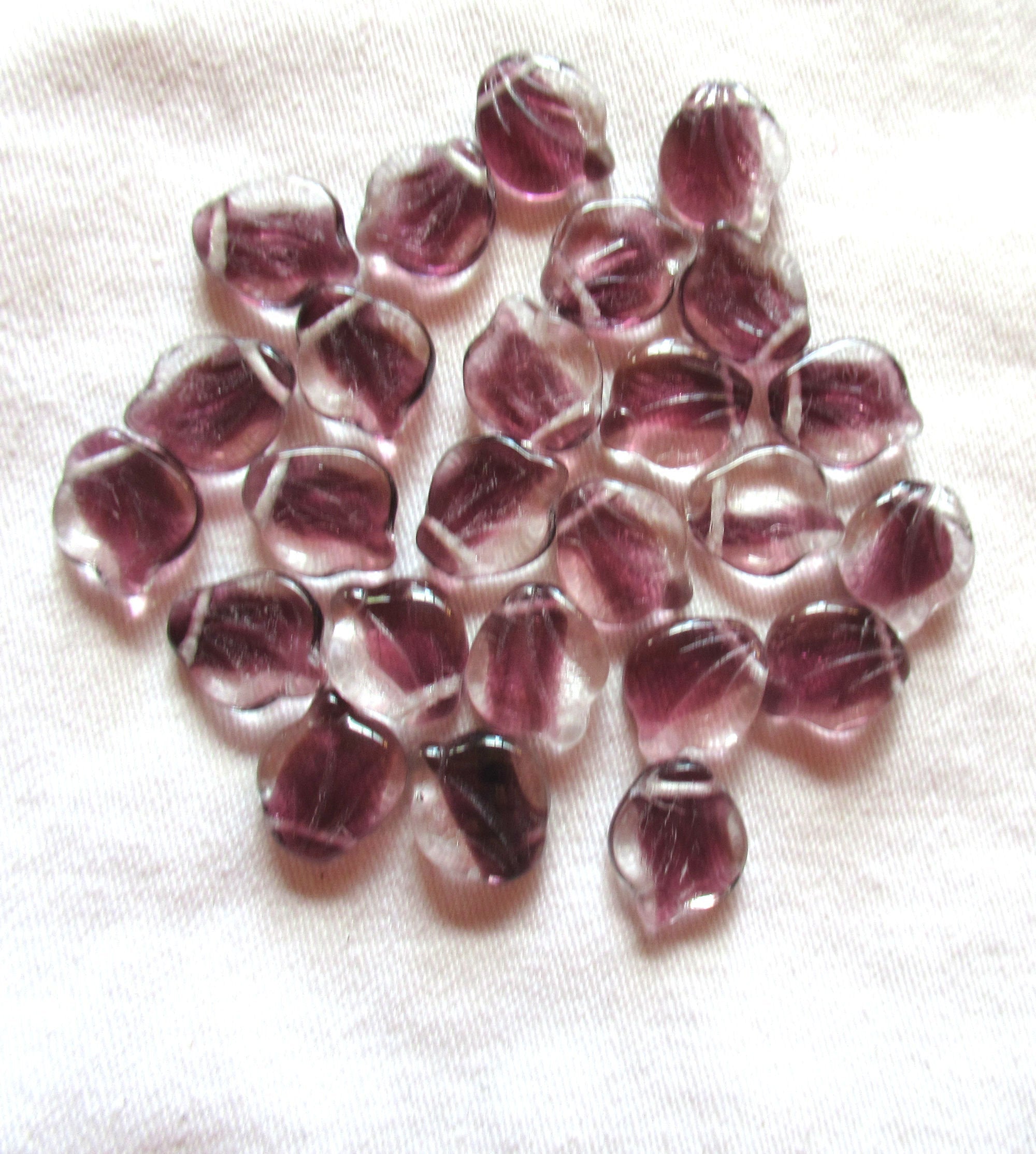 Ten 12 x 15m large Czech glass leaf beads, - crystal clear with streaks of purple or amethyst side drilled beads