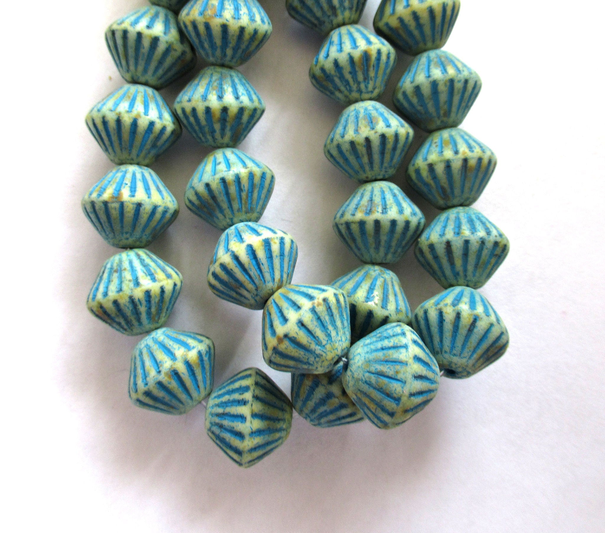 Five Czech glass bicones - 11mm x 10mm - opaque off white with a turquoise blue wash - carved, chunky, rustic bicone beads C0065