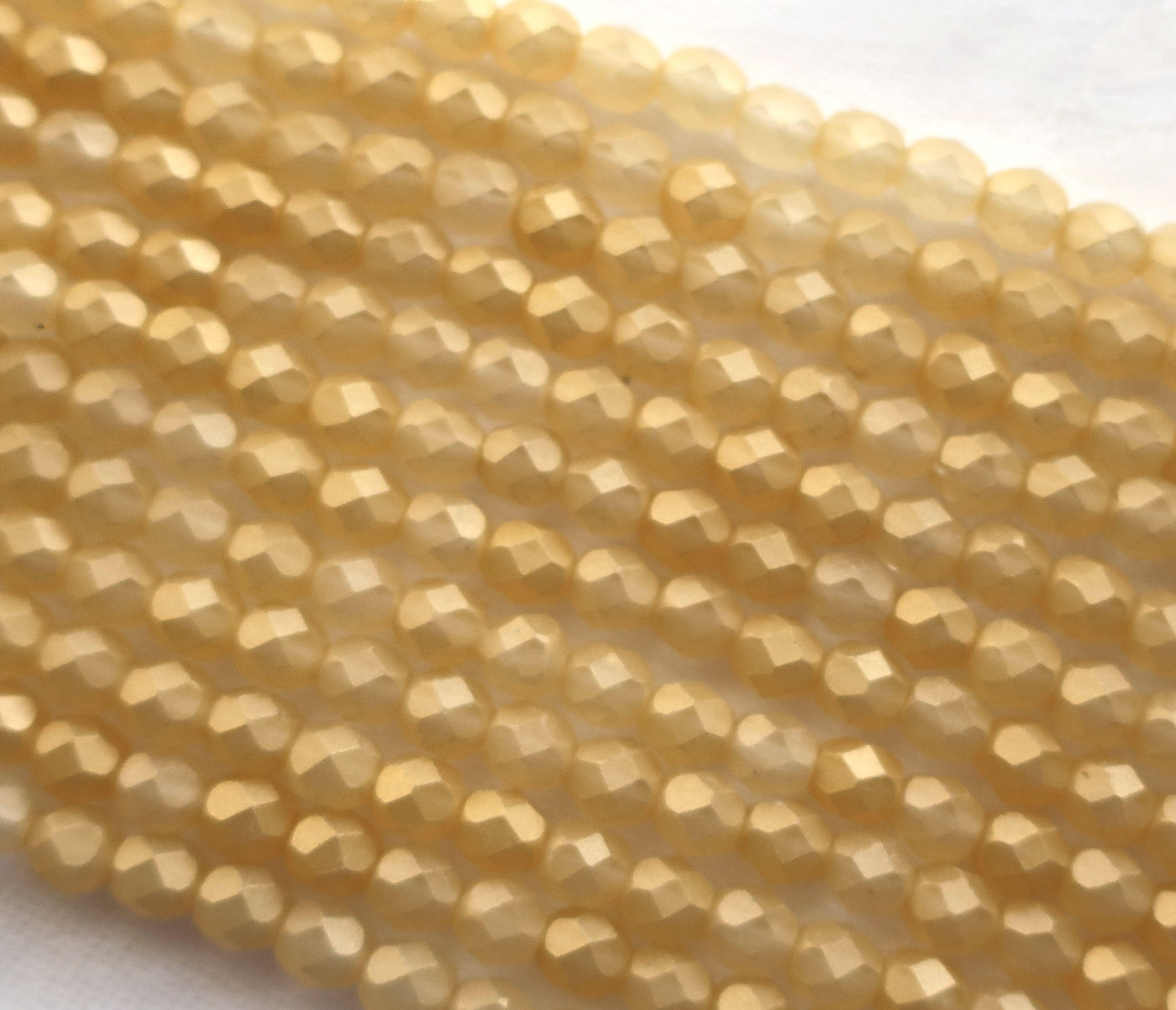 Lot of 25 6mm Sueded Gold Lame, Amber faceted round firepolished glass beads with a frosted gold finish C6425 - Glorious Glass Beads