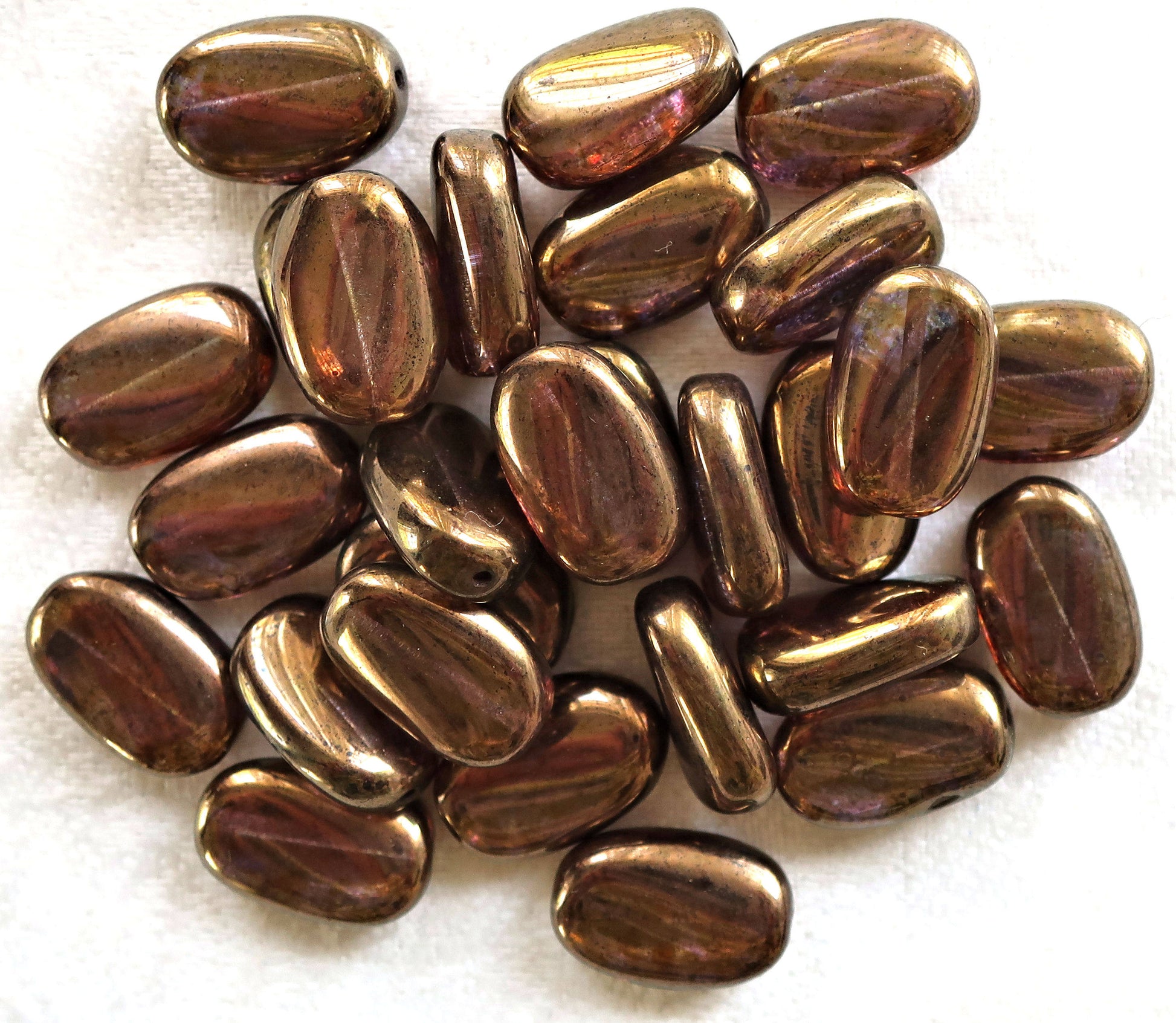 Lot of 25 Lumi Brown slightly twisted oval Czech Glass beads, 14mm x 8mm pressed glass beads C36125 - Glorious Glass Beads