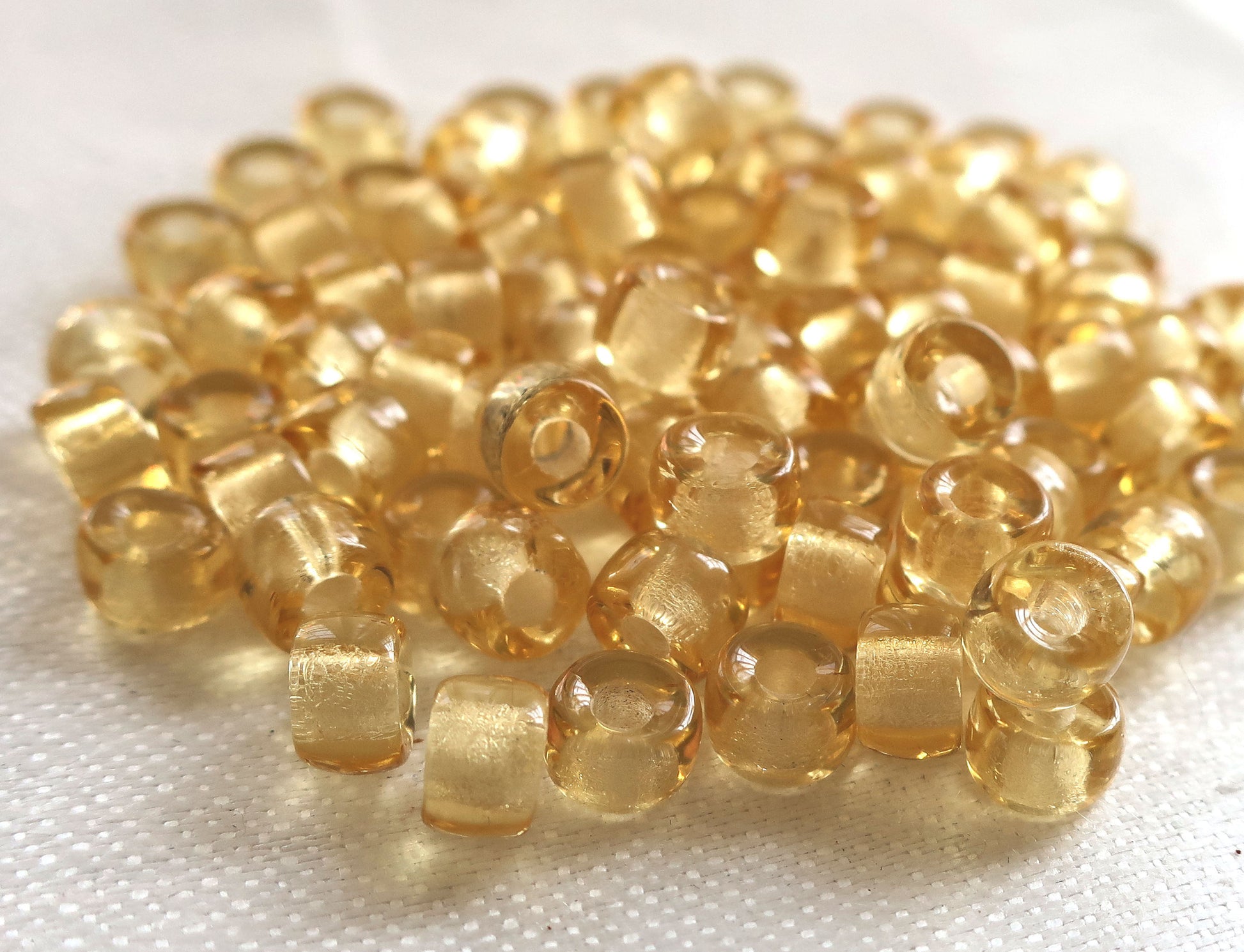 Lot of 50 6mm Czech light amber, honey colored glass pony roller beads, large hole crow beads, C1301 - Glorious Glass Beads