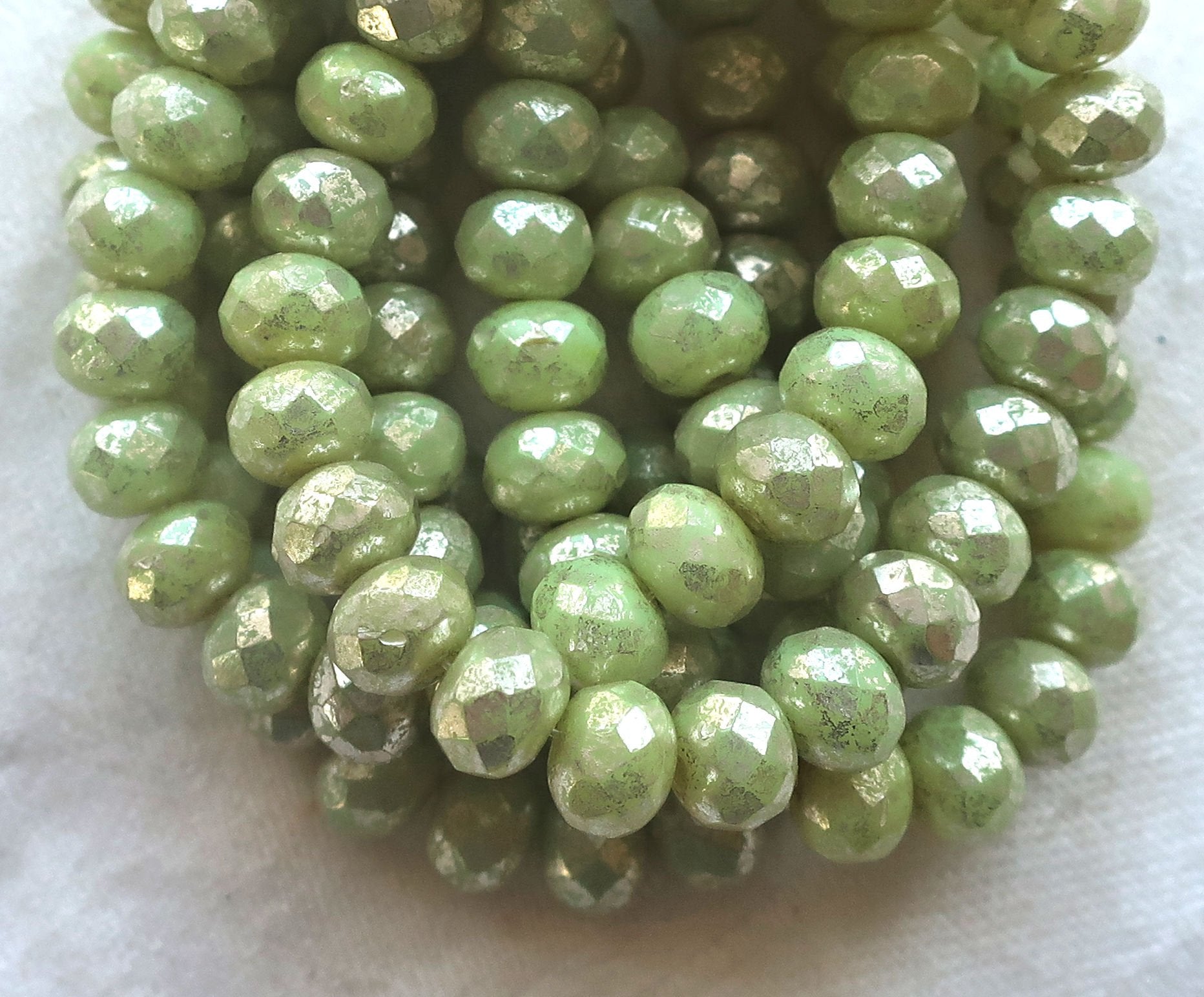 Lot of 25 Czech glass faceted puffy rondelle beads, opaque light honeydew Green with a silver mercury finish, donut beads, 5 x 7mm C00201 - Glorious Glass Beads