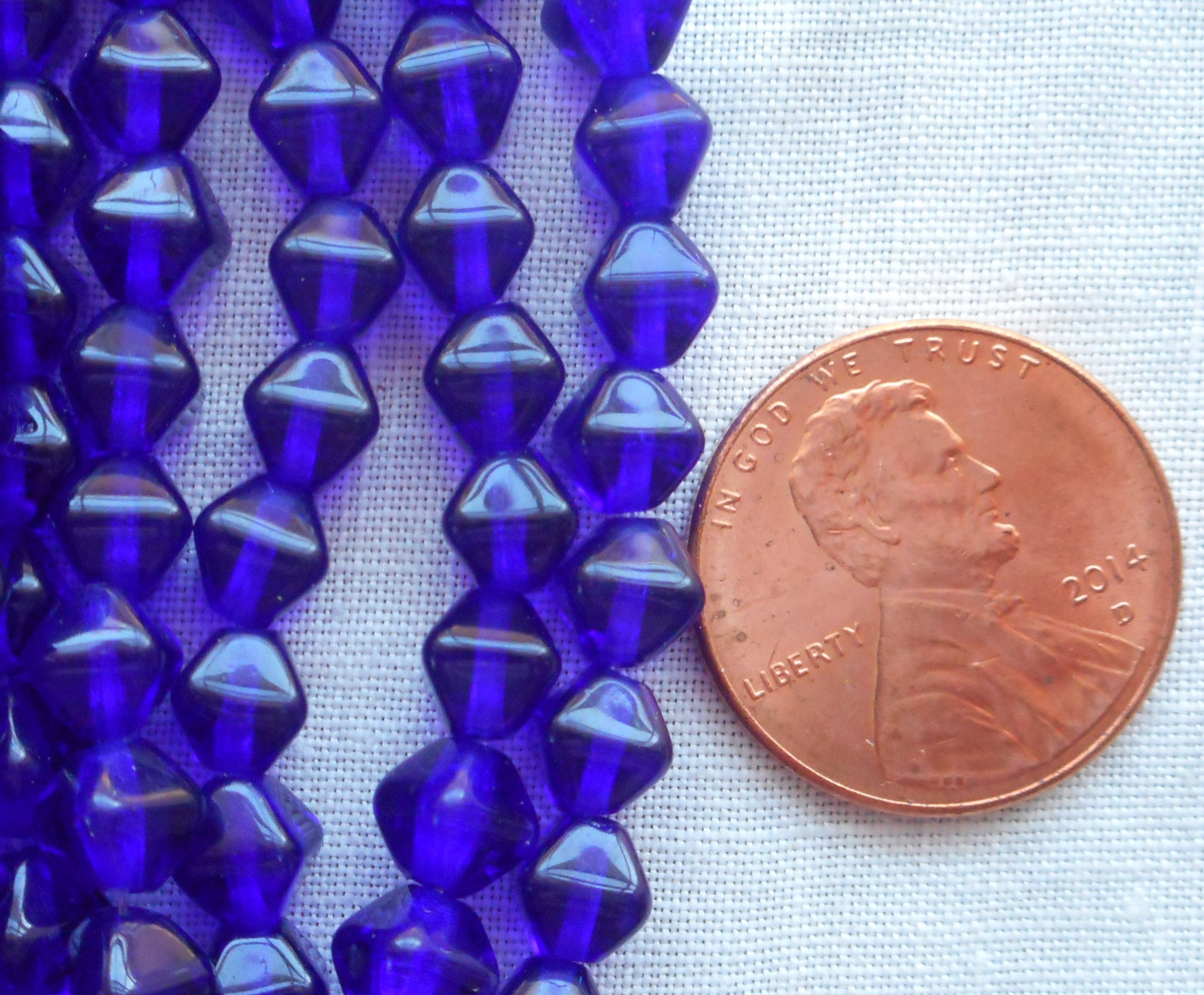 Fifty 6mm Cobalt Blue bicone pressed glass Czech beads, C0093