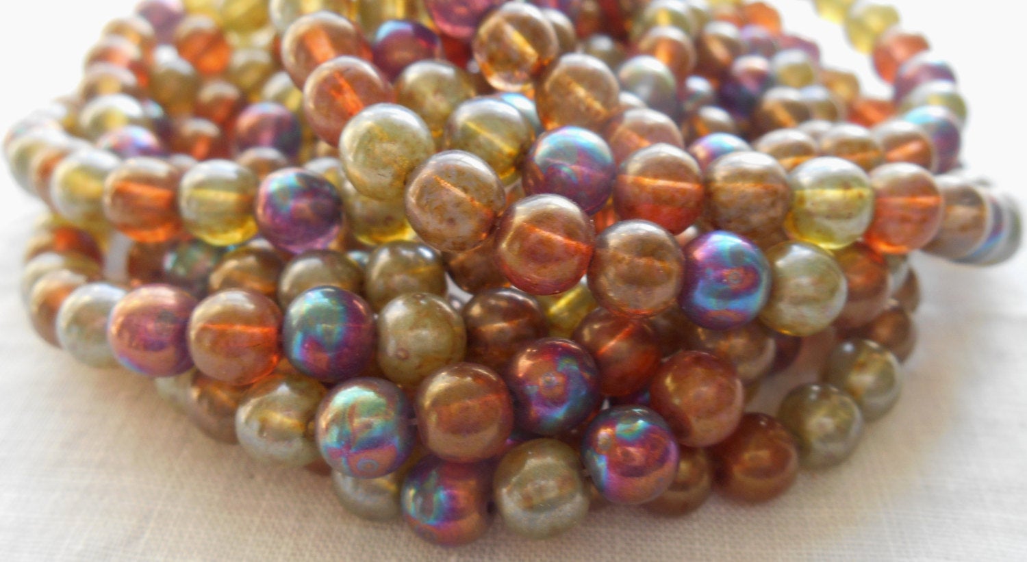 30 6mm Czech glass beads, earth tones mix, yellow, umber, purple, green etc. smooth round druk beads with an iridescent luster finish C2901