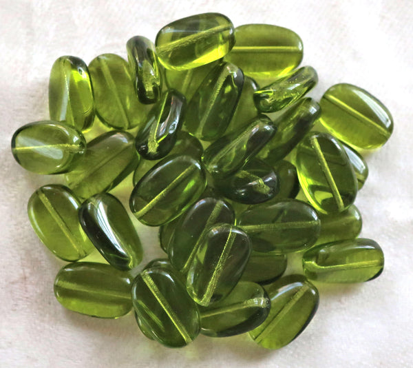 Lot of 15 transparent Olivine, Olive Green slightly twisted oval Czech Glass beads, 14mm x 8mm pressed glass beads C00411