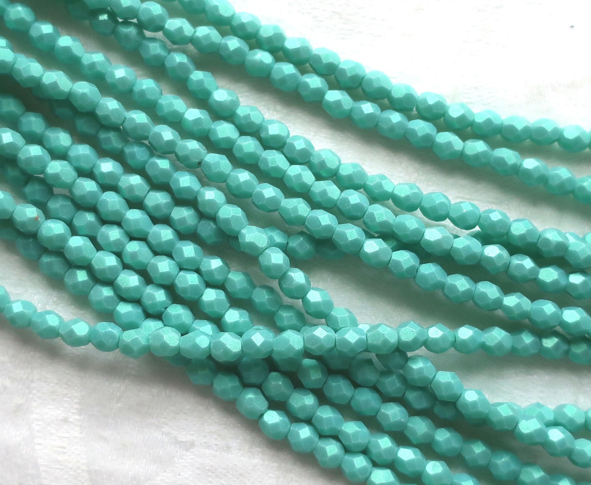 Lot of 50 4mm Opaque Aqua Glow Turquoise Czech glass beads, firepolished, faceted round beads, C3601 - Glorious Glass Beads