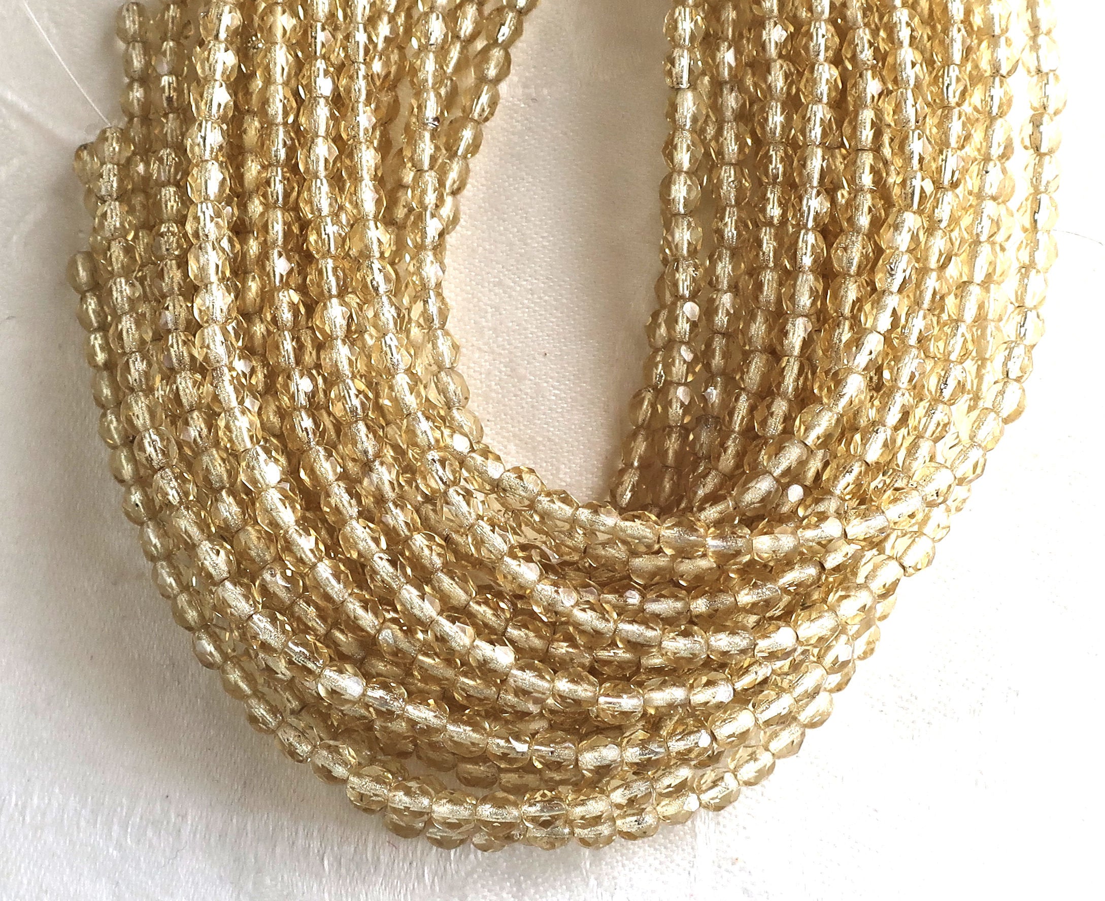 Lot of 50 4mm Light Topaz Czech glass beads, silver lined faceted round firepolished beads C5501 - Glorious Glass Beads