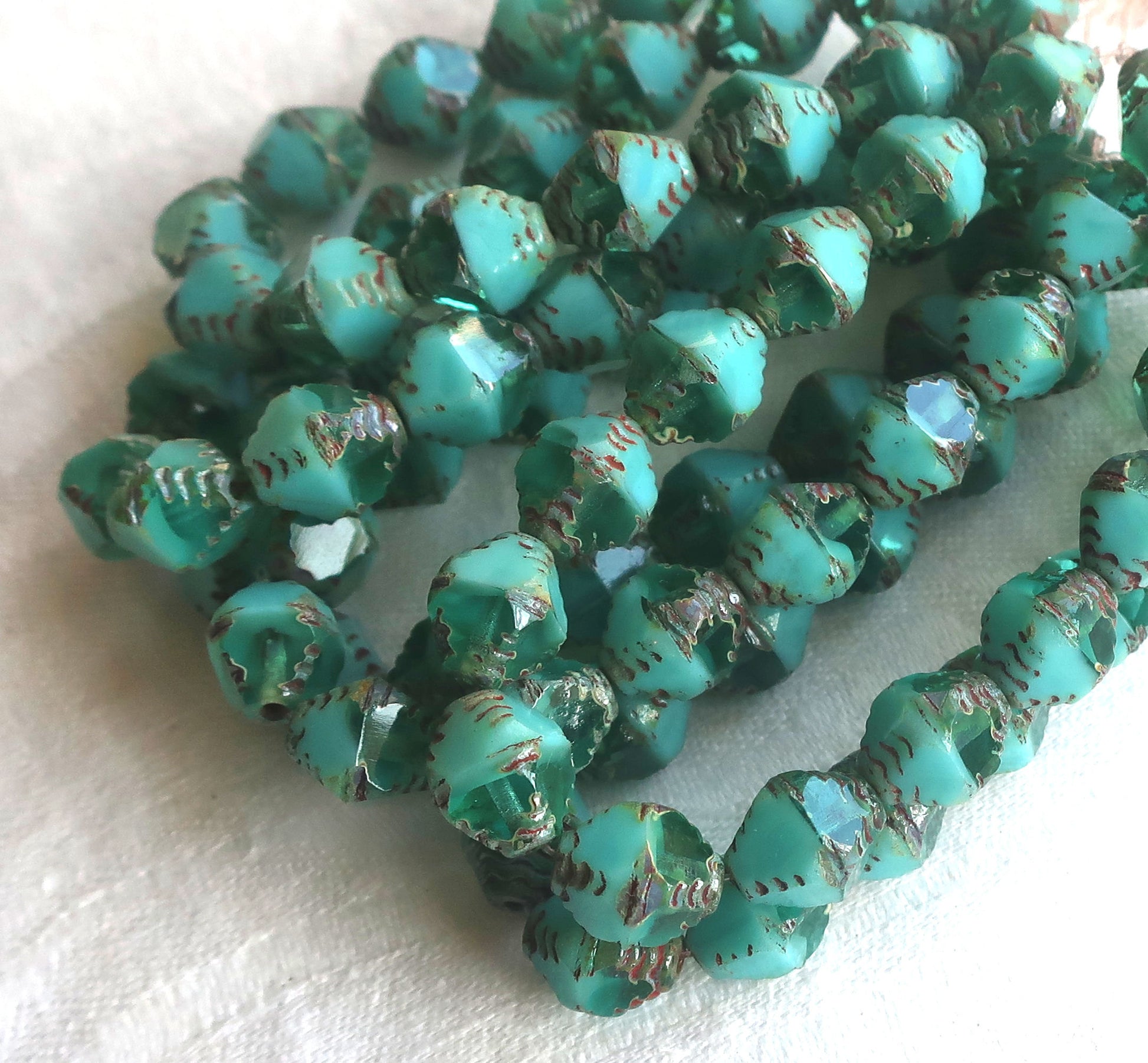 Lot of 15 Czech glass bicones, turquoise blue green opaque and transparent mix picasso carved faceted 8 x 10mm large bicone beads, C07201 - Glorious Glass Beads