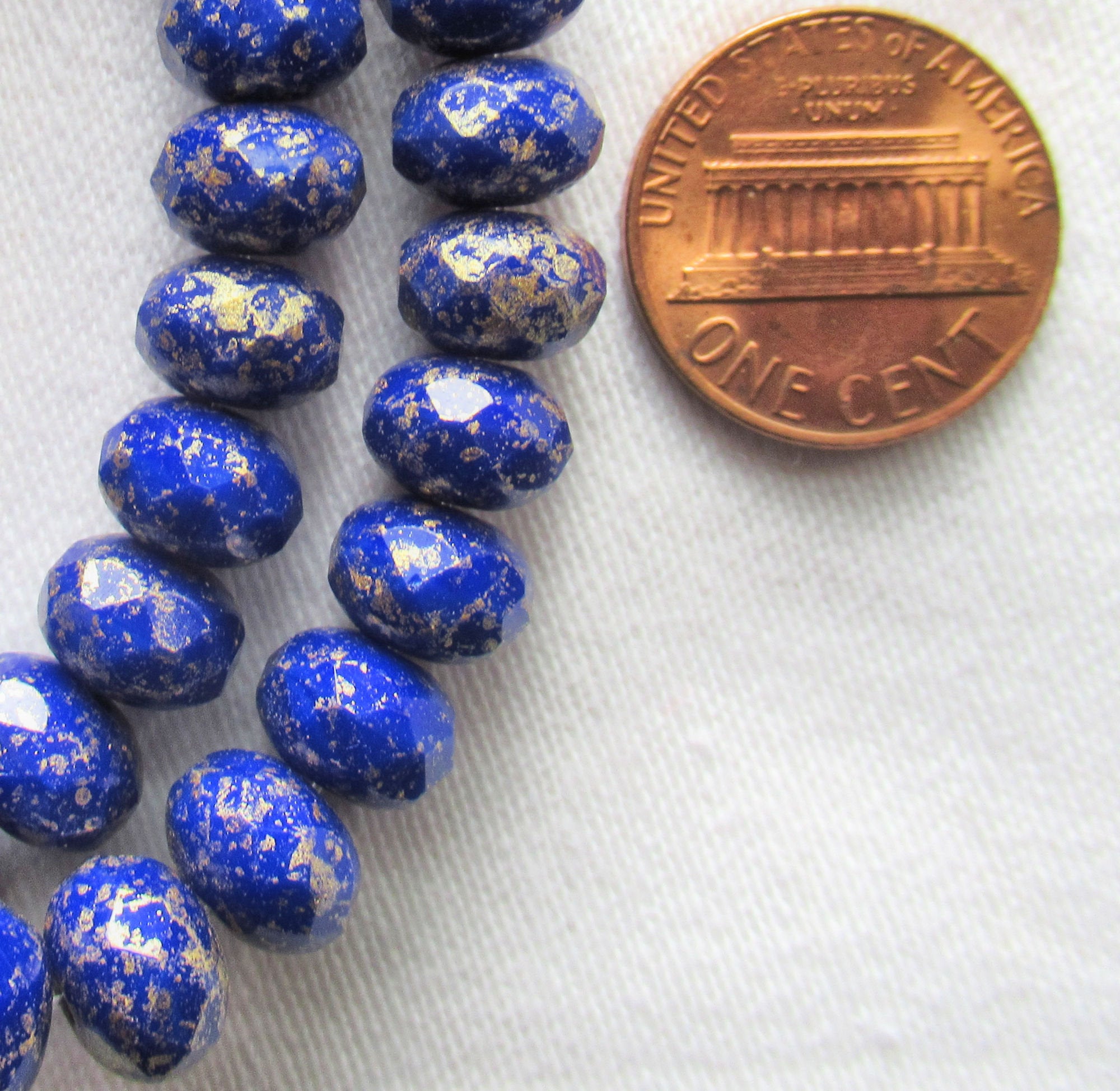 Lot of 25 Czech glass puffy rondelle beads - 8 x 6mm opaque royal blue with gold flecks - faceted rondelles C83301