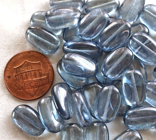 Lot of 25 transparent Lumi Blue slightly twisted oval Czech Glass beads, 14mm x 8mm pressed glass beads C5625 - Glorious Glass Beads