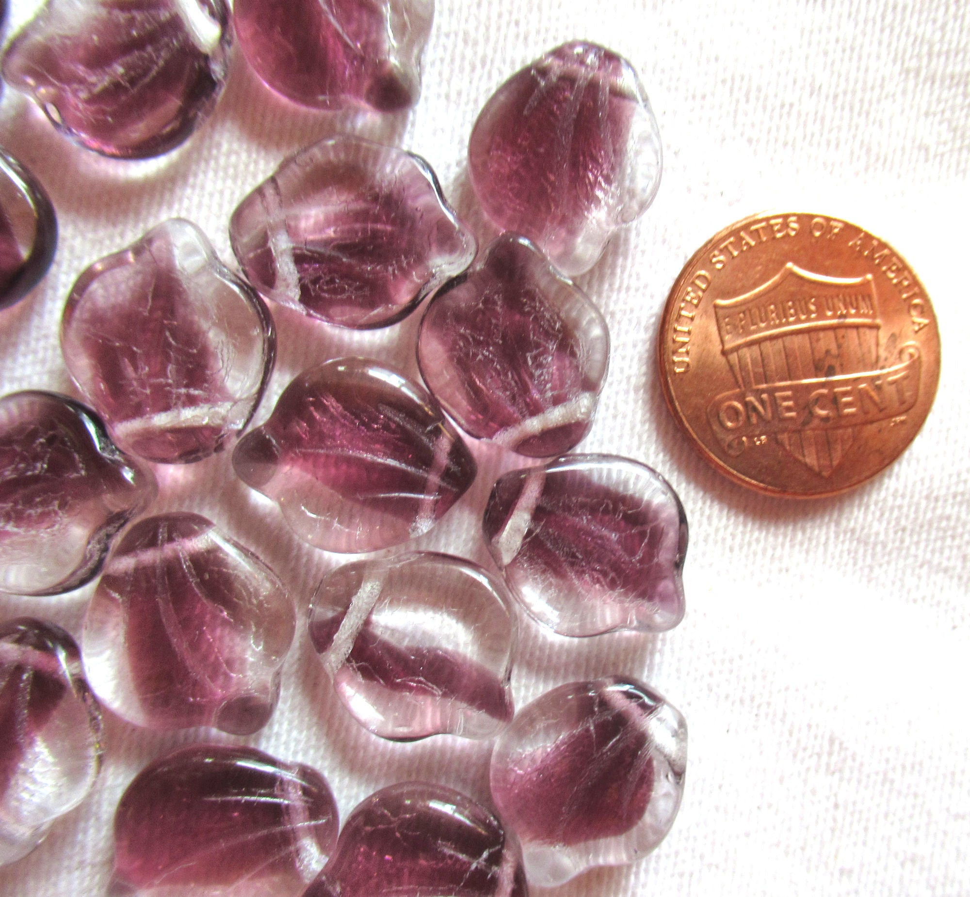 Ten 12 x 15m large Czech glass leaf beads, - crystal clear with streaks of purple or amethyst side drilled beads