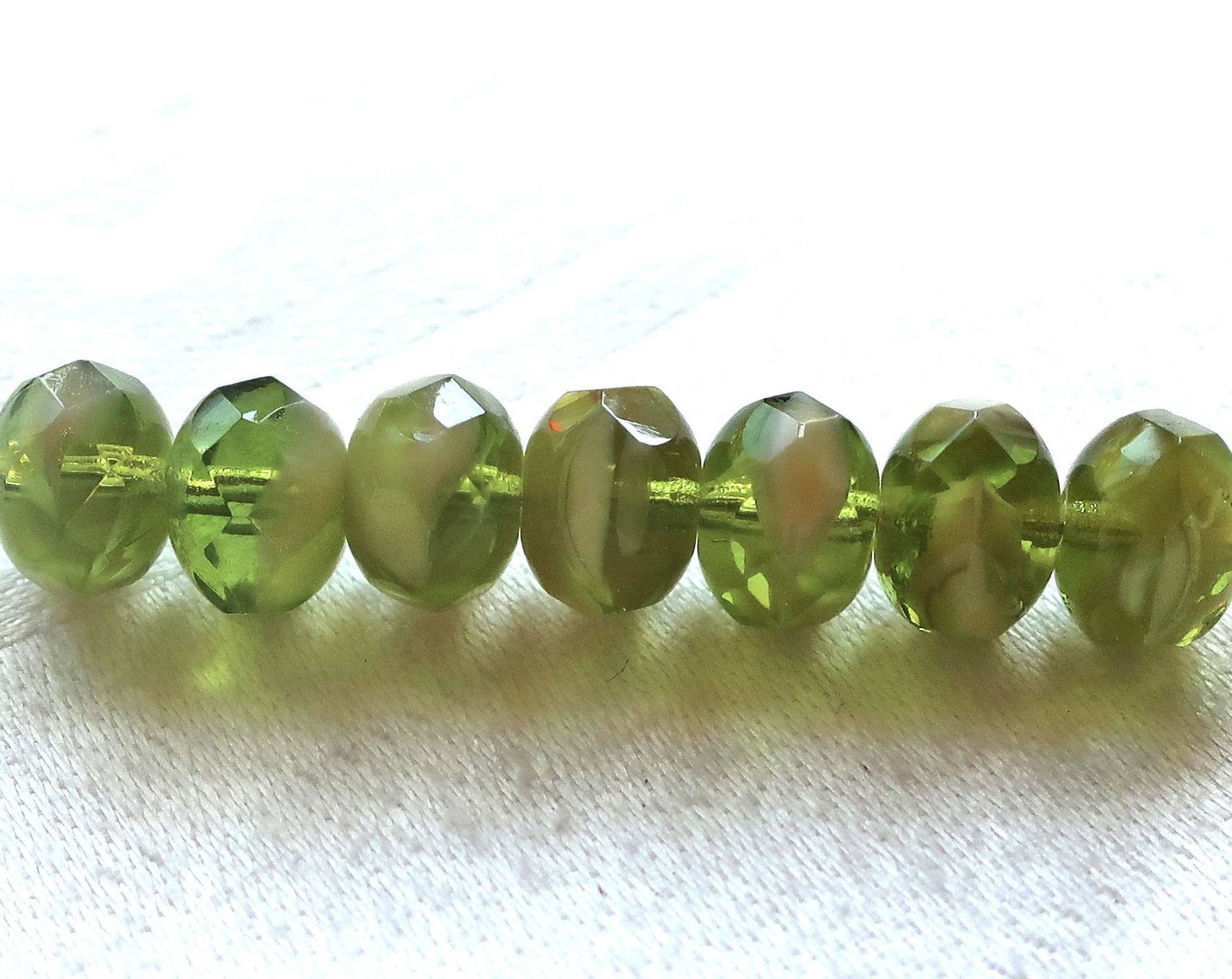 25 faceted Czech glass puffy rondelle beads, 8 x 6mm transparent & opaque marbled olivine green and white mix rondelles on sale 03101 - Glorious Glass Beads
