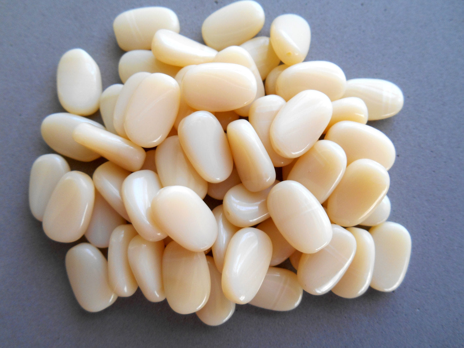 25 Off White, Cream slightly twisted oval Czech Glass beads, 14mm x 8mm pressed glass beads C3625 - Glorious Glass Beads