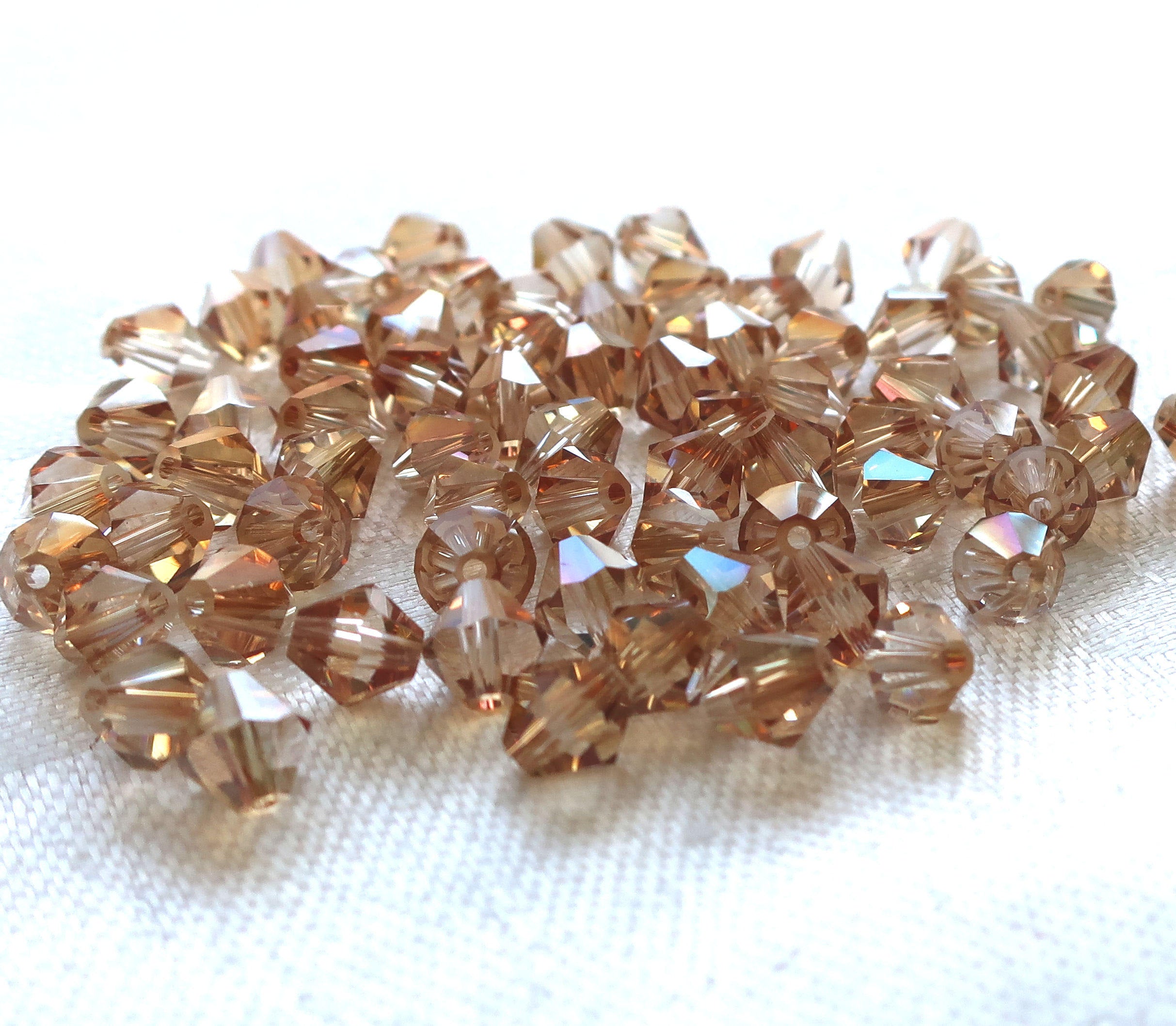 Lot of 24 6mm Celsian Czech Preciosa Crystal bicone beads, faceted golden amber glass bicones C7801