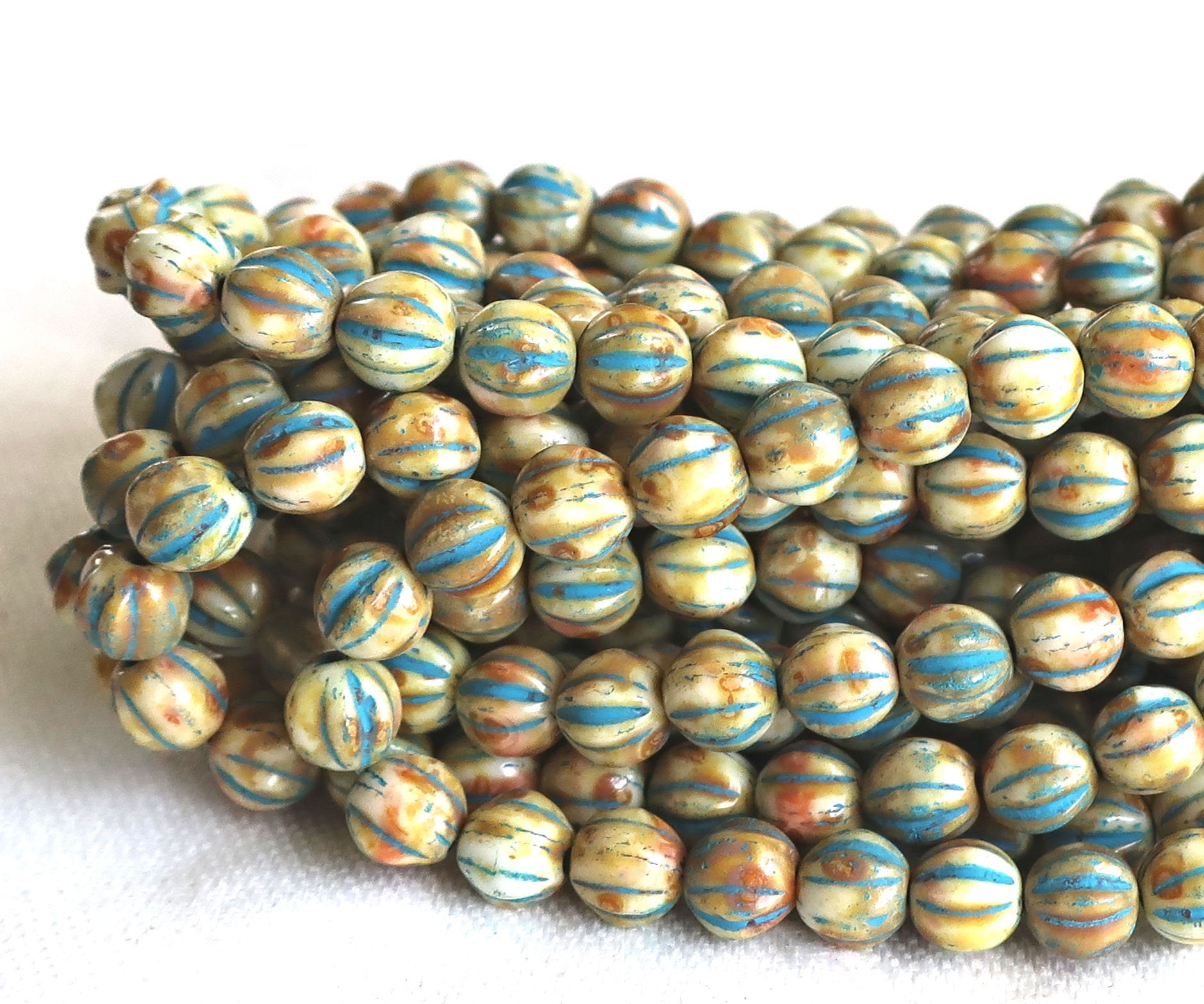 25 Striped ivory, off white & blue melon beads, 6mm pressed Czech glass beads with a turquoise wash C2701 - Glorious Glass Beads