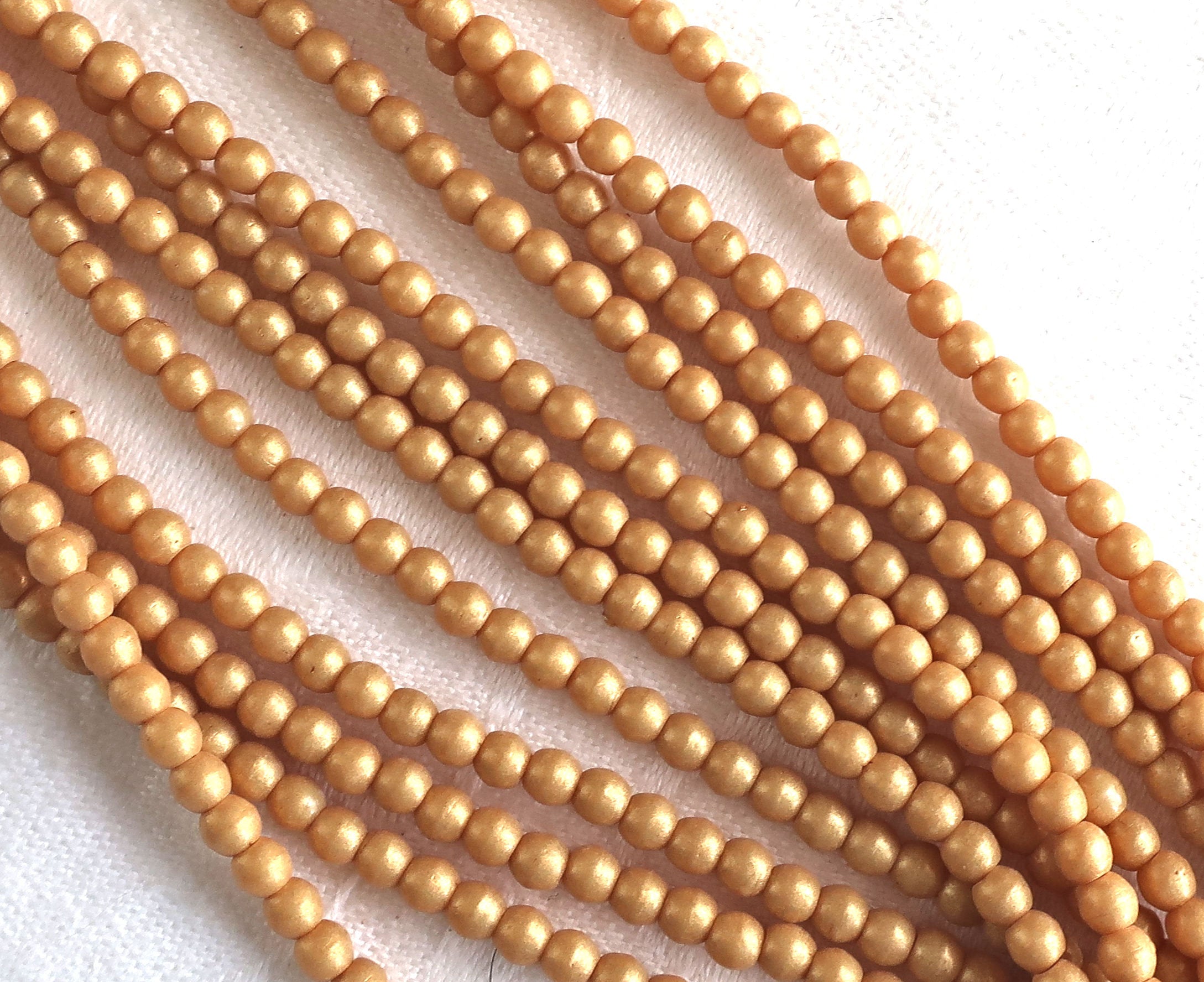 Lot of 100 3mm Czech glass druks, opaque beige, yellow / gold Pacifica Ginger smooth round druk beads C7750 - Glorious Glass Beads