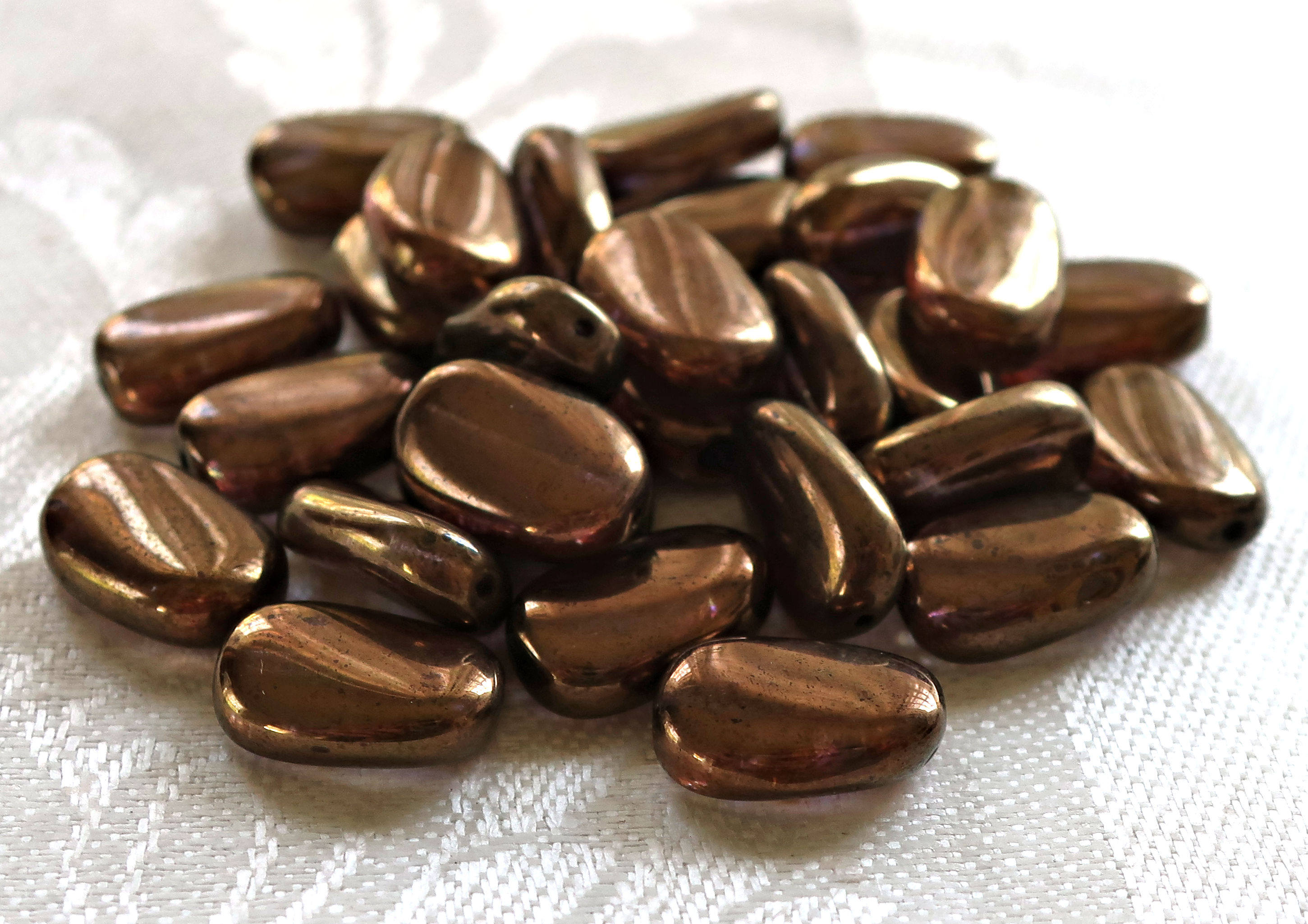 Lot of 25 Lumi Brown slightly twisted oval Czech Glass beads, 14mm x 8mm pressed glass beads C36125 - Glorious Glass Beads