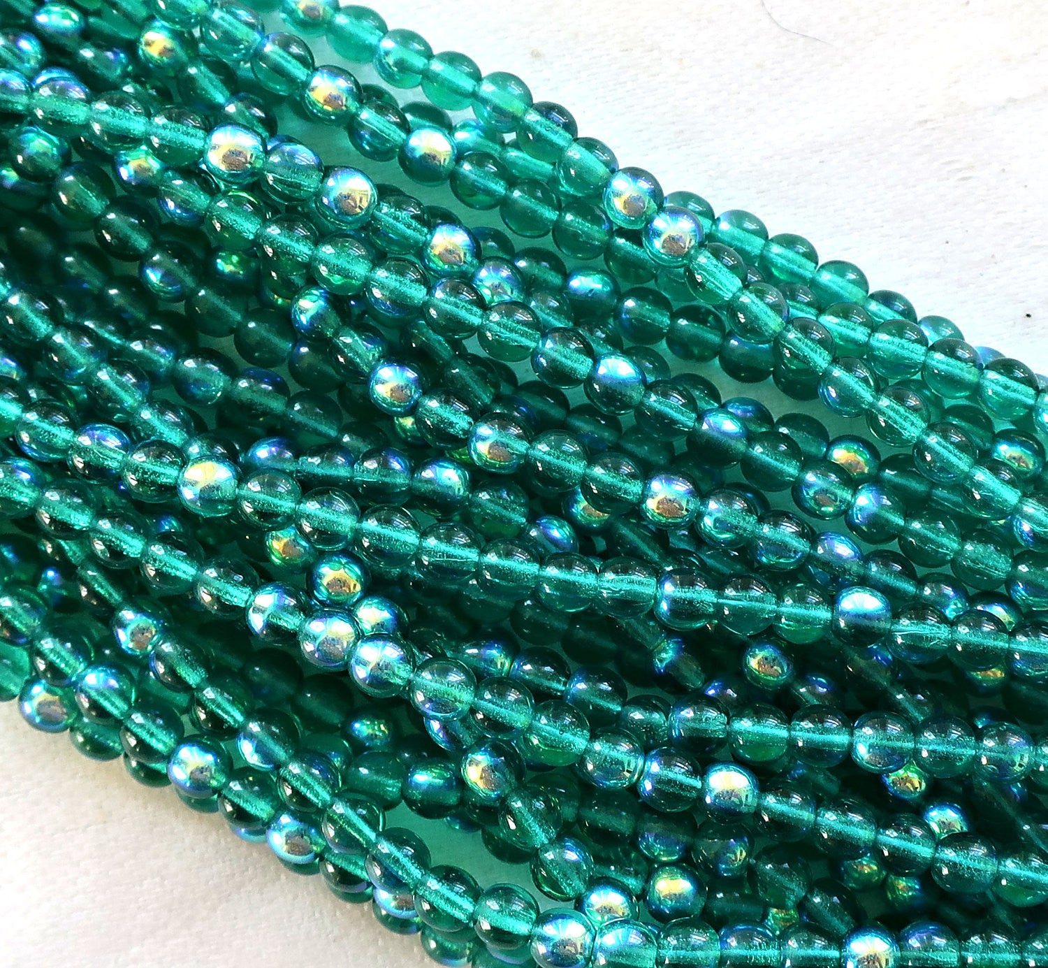 Lot of 100 4mm Emerald Green AB Czech glass druks, pressed glass round druk beads C7601 - Glorious Glass Beads