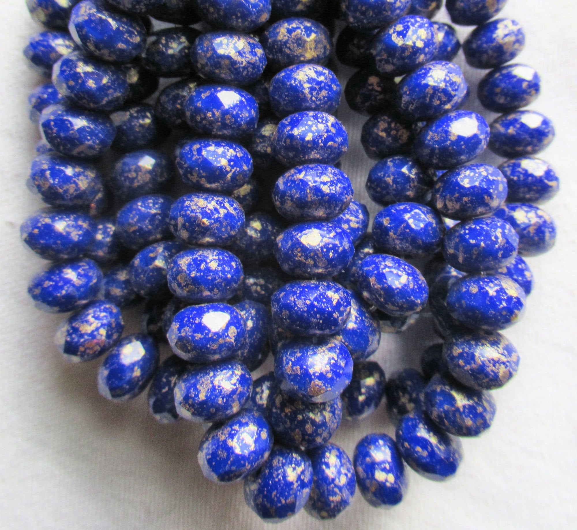 Lot of 25 Czech glass puffy rondelle beads - 8 x 6mm opaque royal blue with gold flecks - faceted rondelles C83301