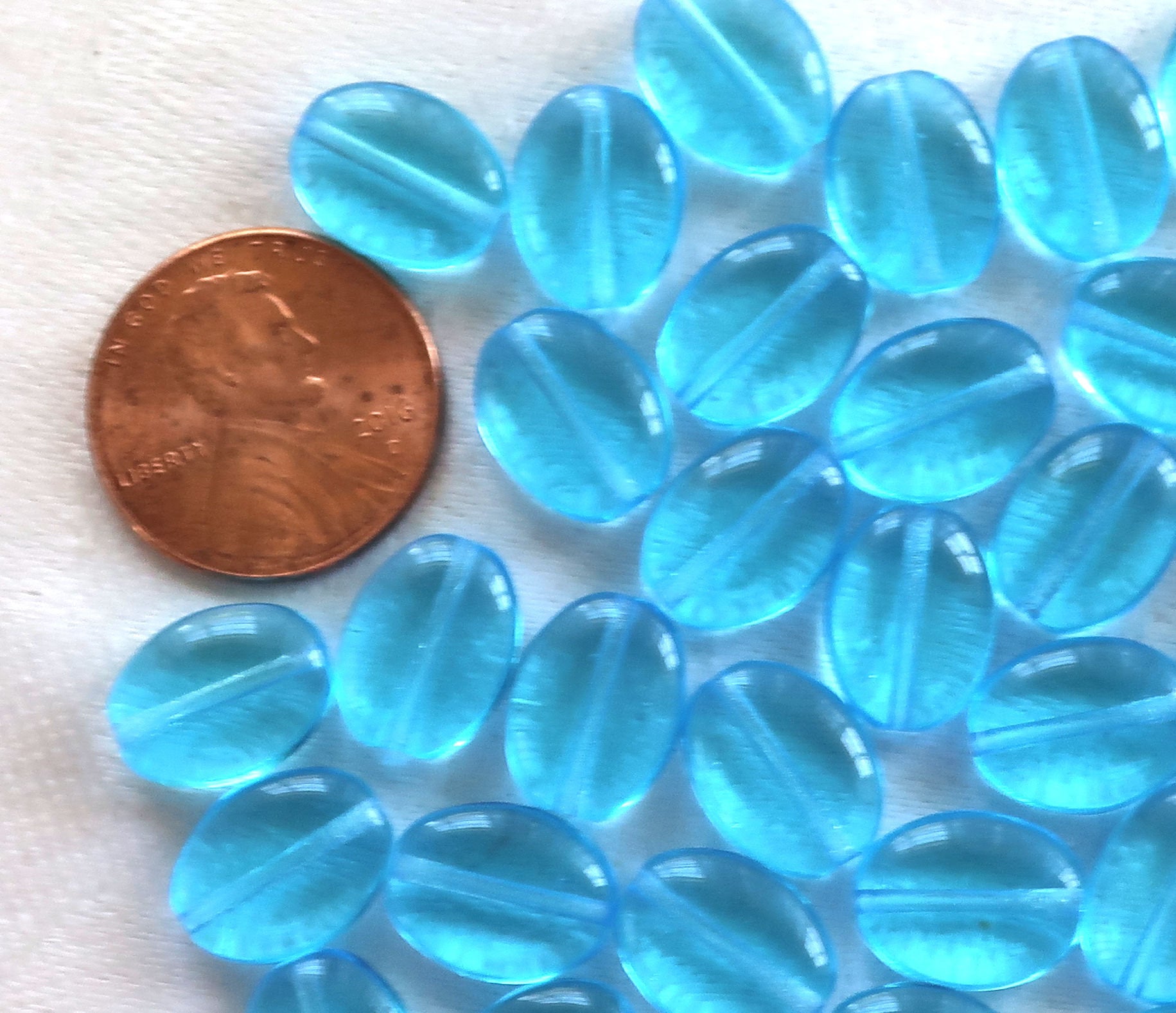 25 transparent Aqua Blue flat oval Czech Glass beads, 12mm x 9mm pressed glass beads C7425 - Glorious Glass Beads
