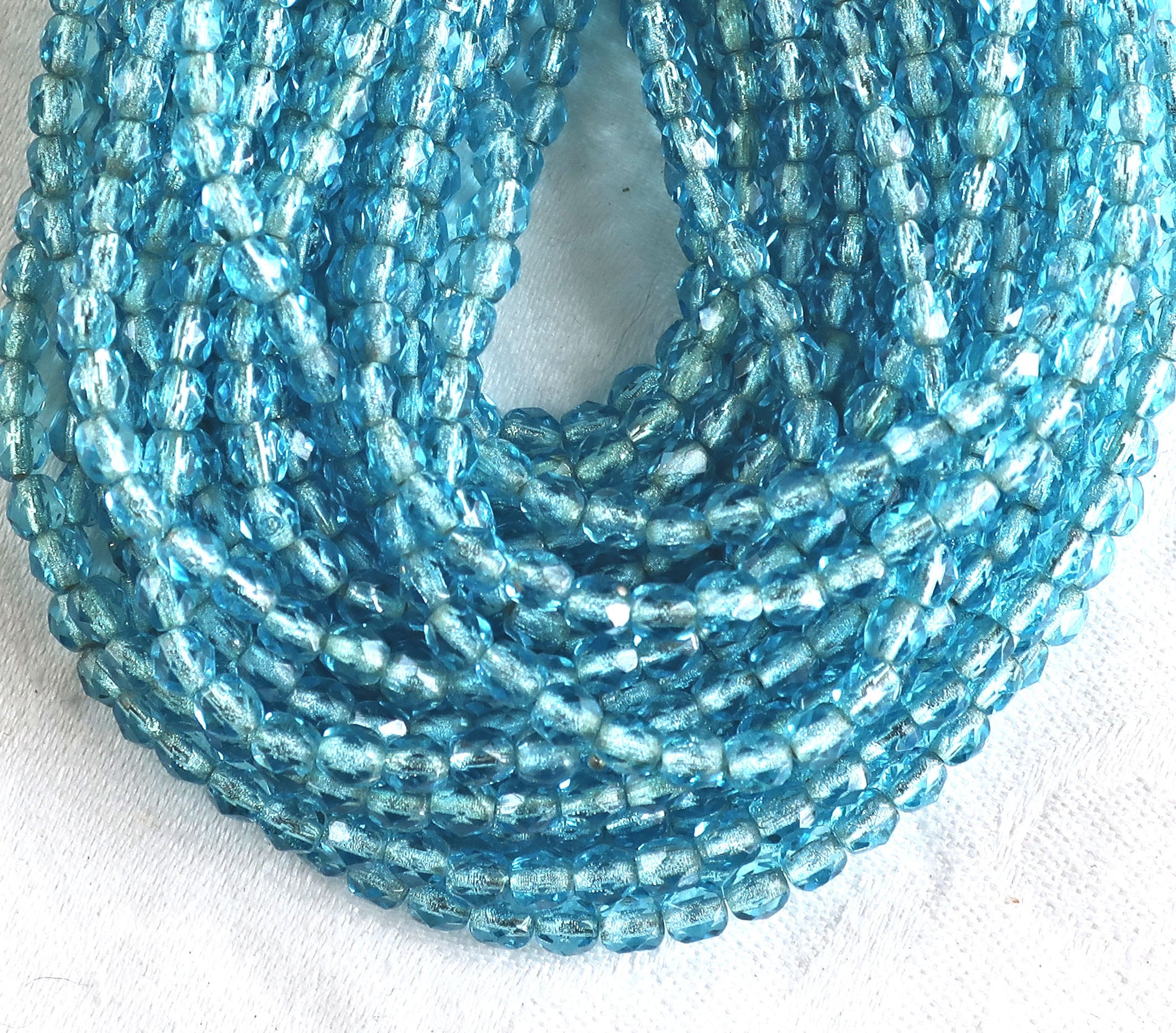 Lot of 50 4mm Aqua Blue silver lined Czech glass beads, Aquamarine firepolished faceted round beads C9601 - Glorious Glass Beads