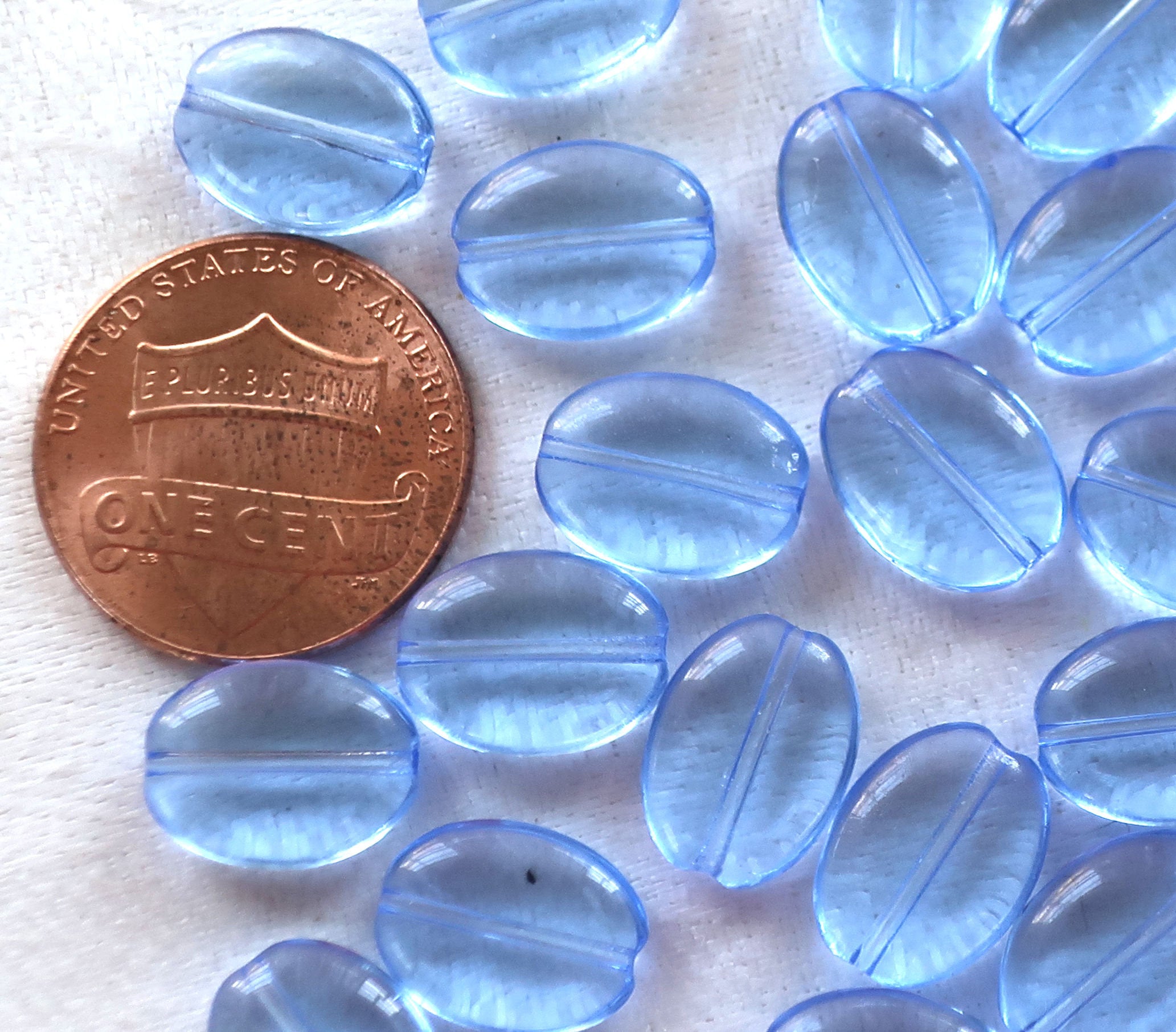 25 transparent light sapphire blue flat oval Czech Glass beads, 12mm x 9mm pressed glass beads C6425 - Glorious Glass Beads