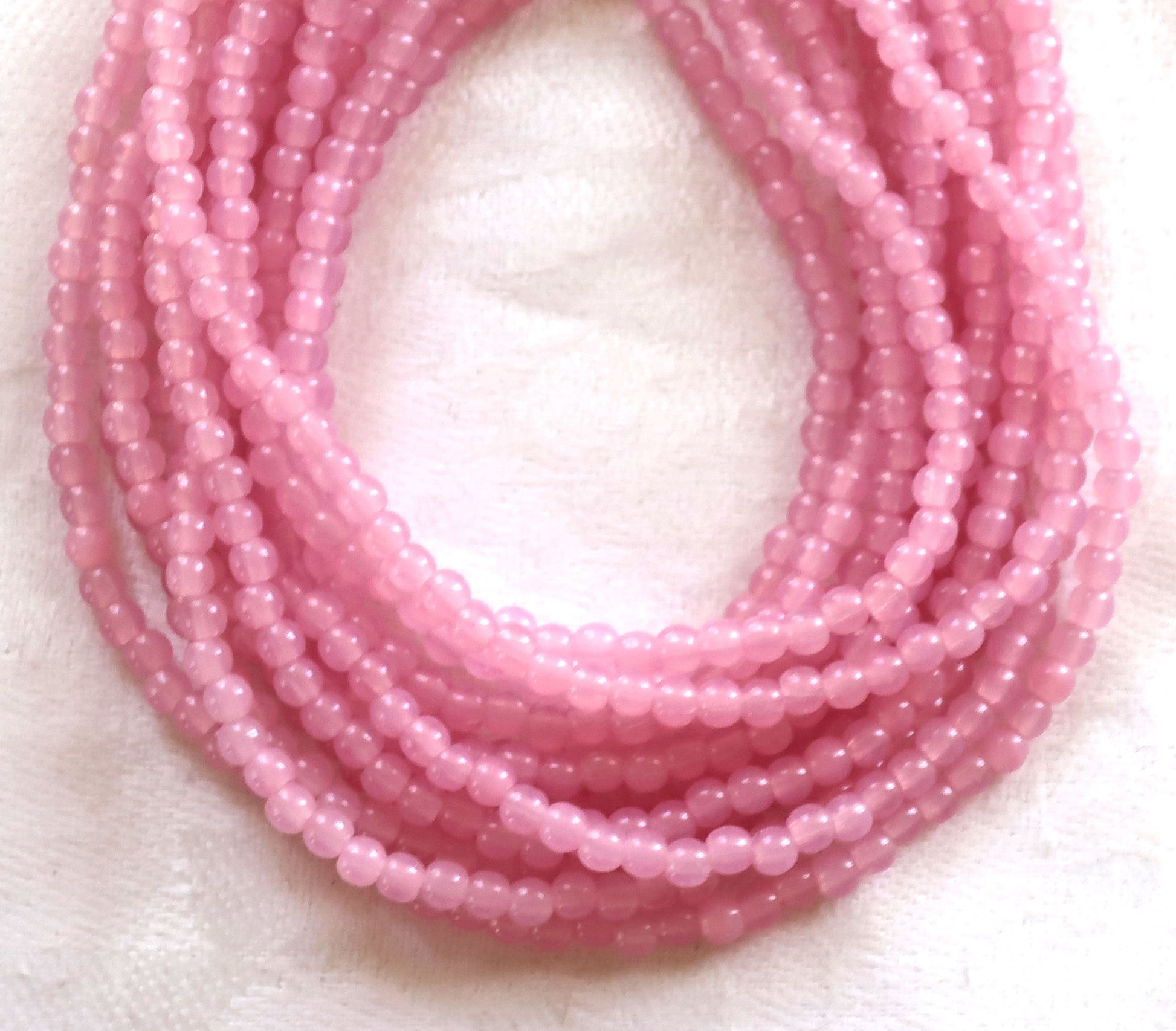 Lot of 100 3mm Milky Pink AB glass Czech glass druks; pressed glass, smooth, round druk beads C8401 - Glorious Glass Beads