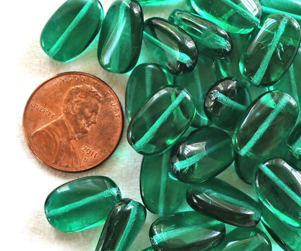 Lot of 25 transparent Teal Green slightly twisted oval Czech Glass beads, 14mm x 8mm pressed glass beads C7325 - Glorious Glass Beads