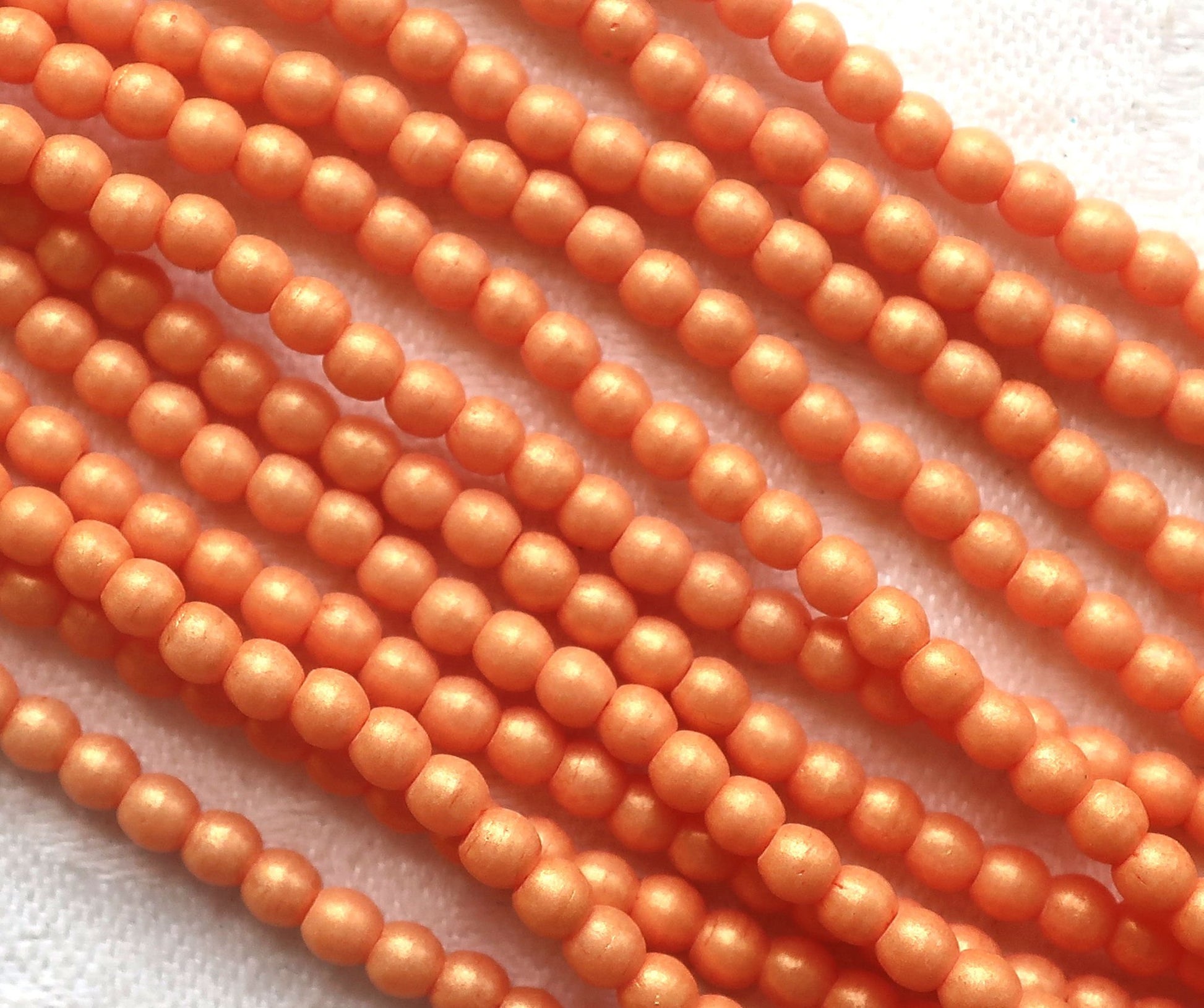 Lot of 100 3mm Czech glass druks; Pacifica Tangerine, opaque creamy orange pressed glass, smooth, round druk beads C7701 - Glorious Glass Beads
