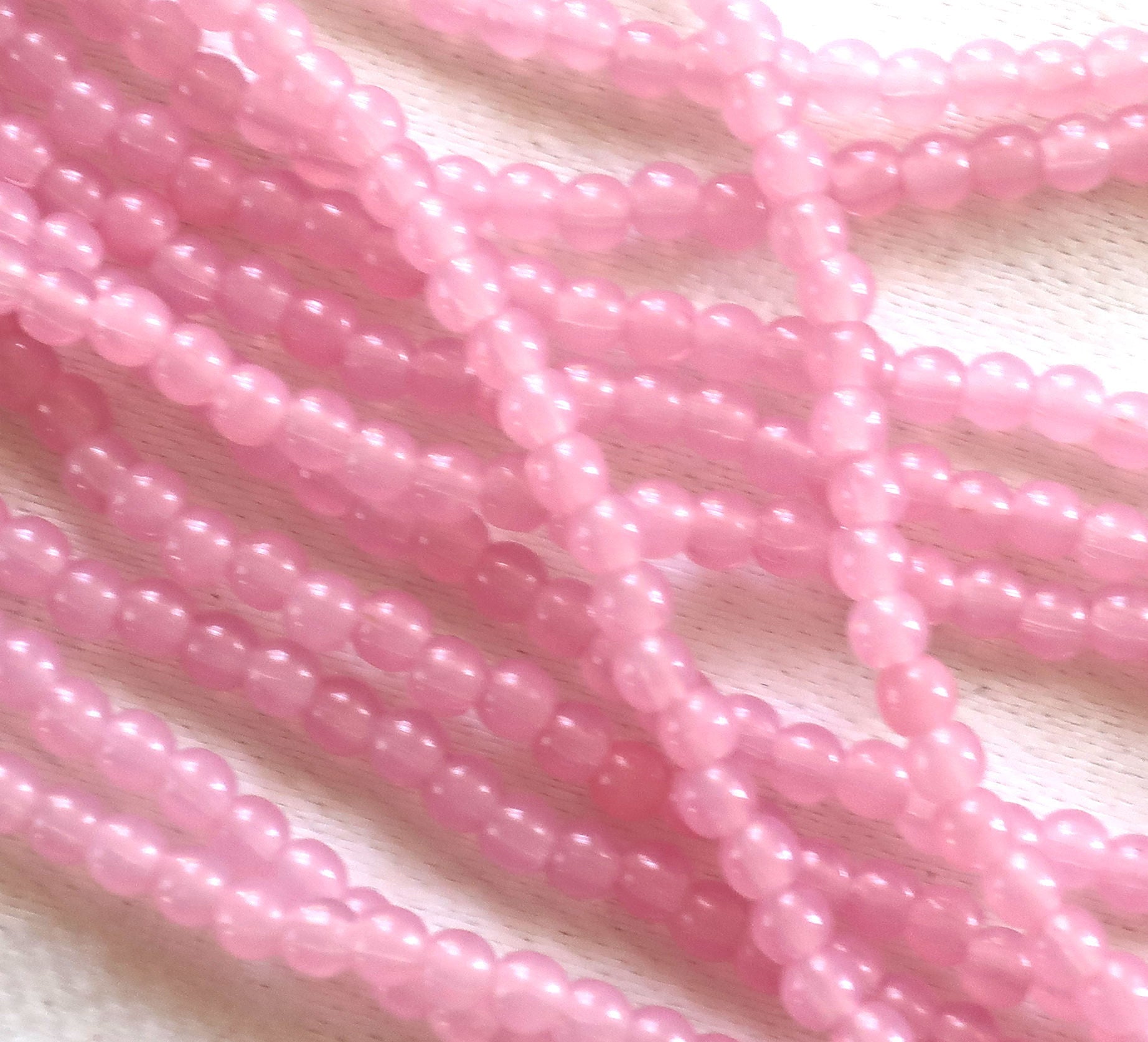 Lot of 100 3mm Milky Pink AB glass Czech glass druks; pressed glass, smooth, round druk beads C8401 - Glorious Glass Beads