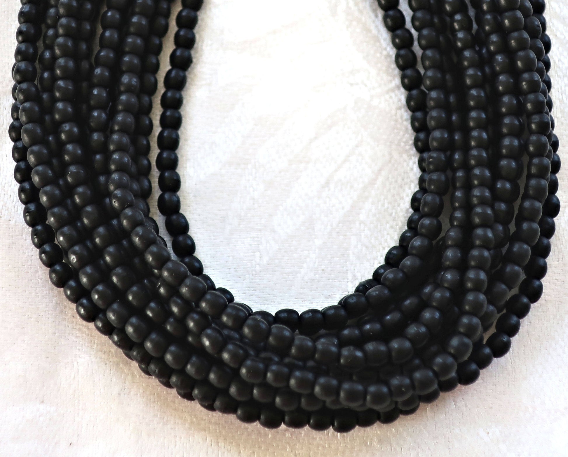 Lot of 100 3mm matte jet black Czech glass druks, smooth round druk beads C4301 - Glorious Glass Beads