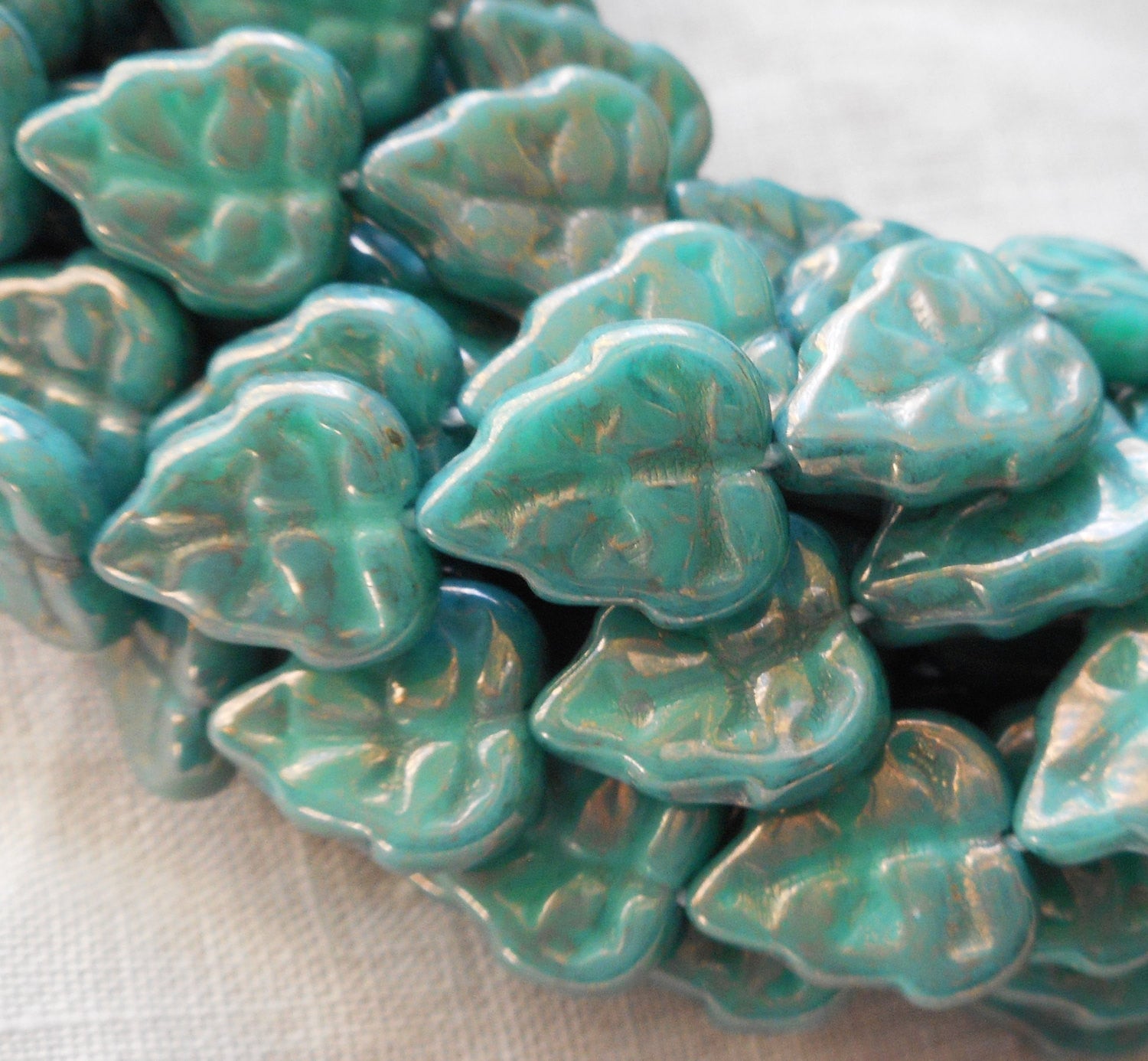 Lot of 25 Czech glass leaf beads, Luster Opaque Turquoise Blue center drilled 8 x 10mm beads C67101 - Glorious Glass Beads