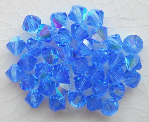 Lot of 24 4mm Sapphire Blue AB Czech Preciosa Crystal bicone beads, faceted glass blue AB bicones C5601 - Glorious Glass Beads