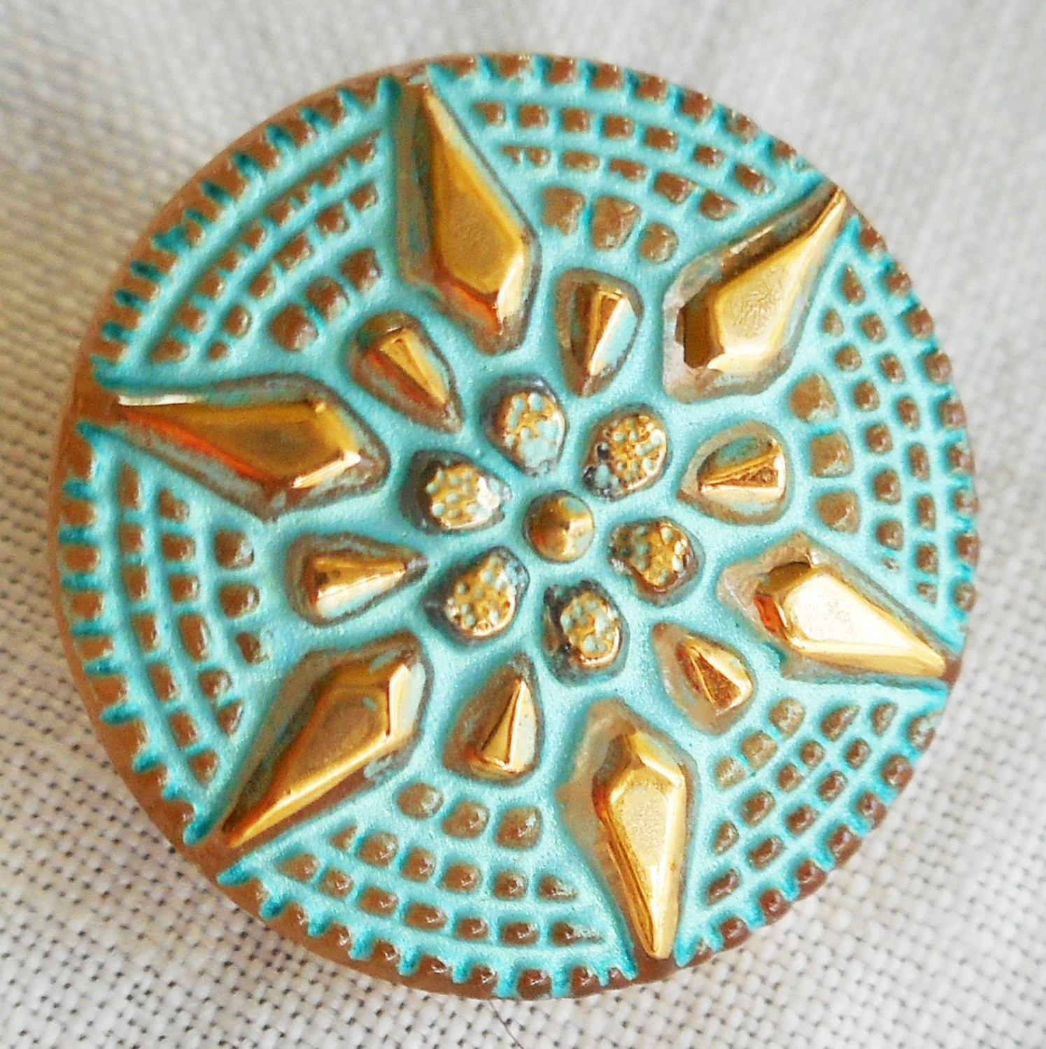One 18mm Czech glass button, with a gold raised star with a turquoise wash, verdigris look decorative shank button 05201 - Glorious Glass Beads