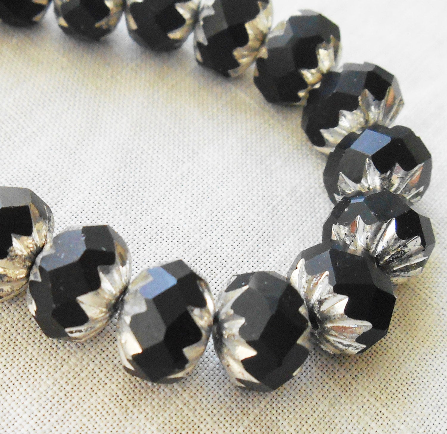Lot of 25 6 x 9mm opaque black and silver picasso Czech glass faceted cruller beads C58201 - Glorious Glass Beads