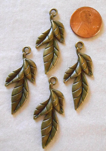 Two antique bronze leaf charms, pendants, 39m by 11mm , three metal leaves C6102 - Glorious Glass Beads
