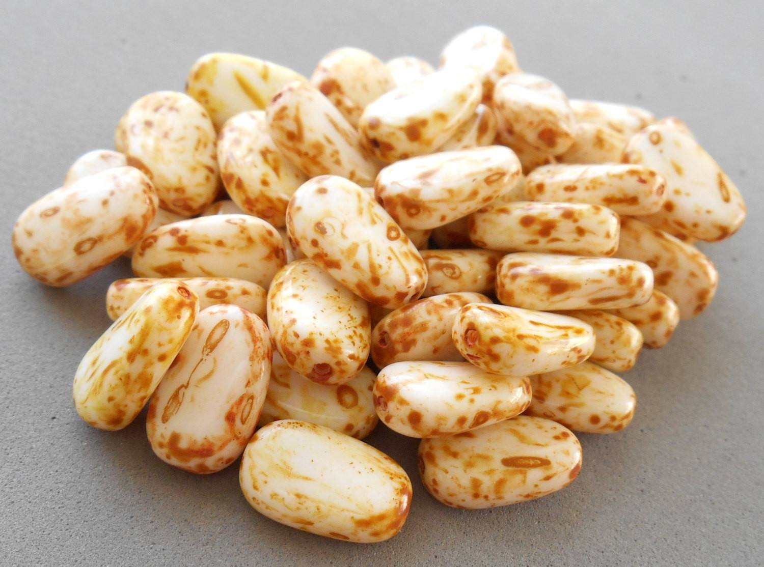 Lot of 25 Butter Pecan White Picasso slightly twisted oval Czech pressed Glass beads, 14mm x 8mm, C3625 - Glorious Glass Beads