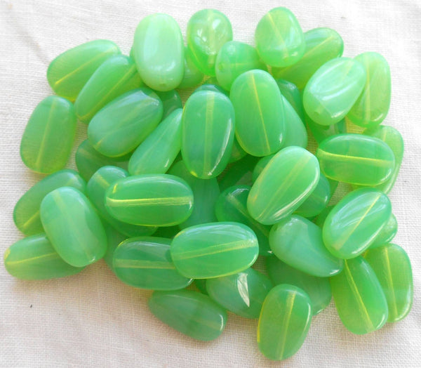 Lot of 25 Jade Green Opal slightly twisted oval Czech pressed Glass beads, 14mm x 8mm, C3625 - Glorious Glass Beads