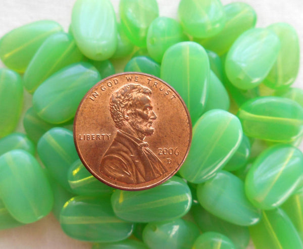 Lot of 25 Jade Green Opal slightly twisted oval Czech pressed Glass beads, 14mm x 8mm, C3625 - Glorious Glass Beads