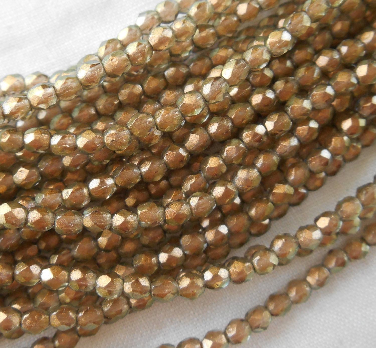 Fifty 3mm Halo Linen Czech Green glass over gold firepolished, faceted round beads, C8625 - Glorious Glass Beads