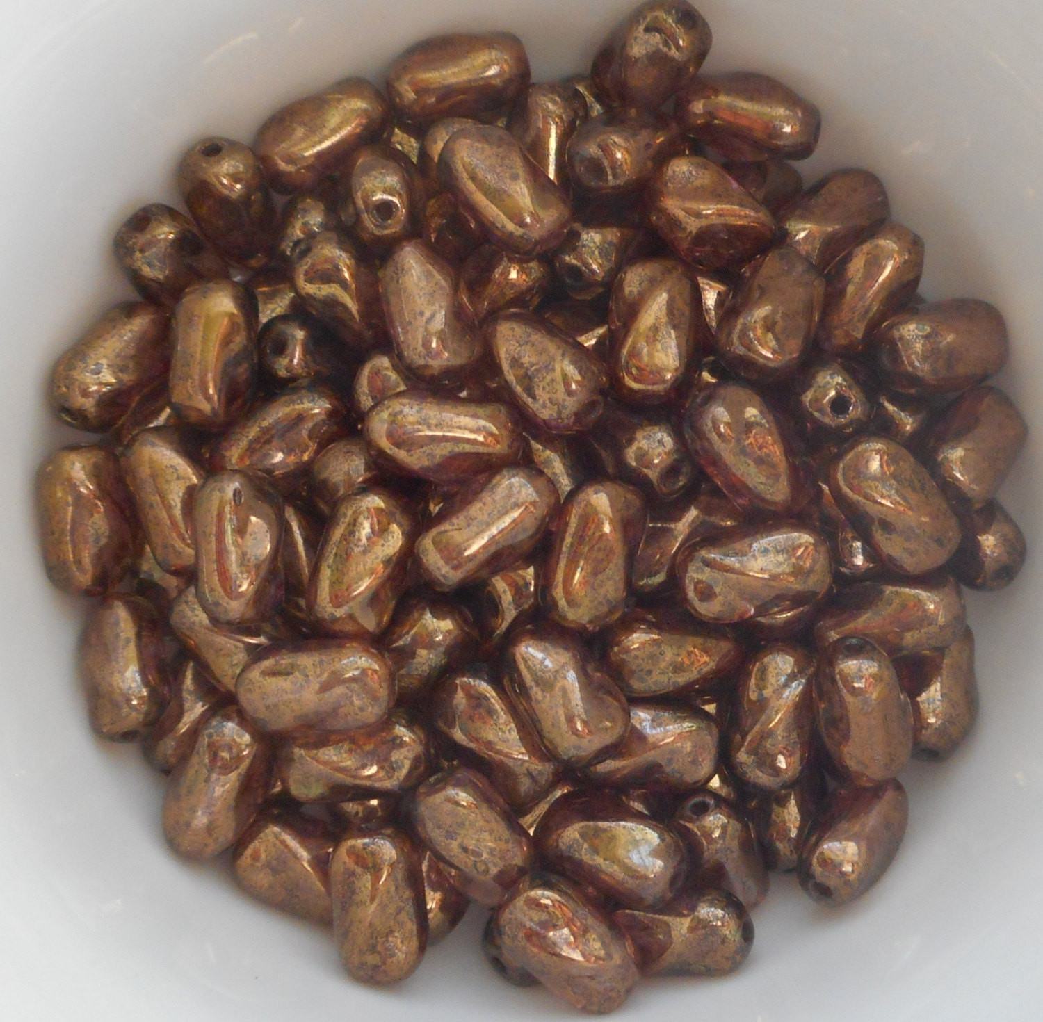 Lot of 25 9mm x 6mm Lumi Brown Iridescent Czech glass twisted oval beads, C8825 - Glorious Glass Beads