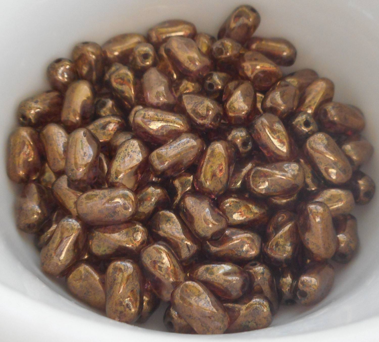 Lot of 25 9mm x 6mm Lumi Brown Iridescent Czech glass twisted oval beads, C8825 - Glorious Glass Beads