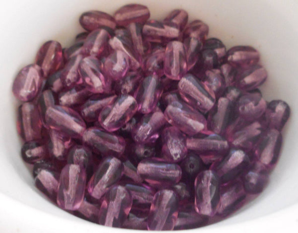 Lot of 25 9mm x 6mm light Amethyst, Purple Czech glass twisted oval beads, C5625 - Glorious Glass Beads
