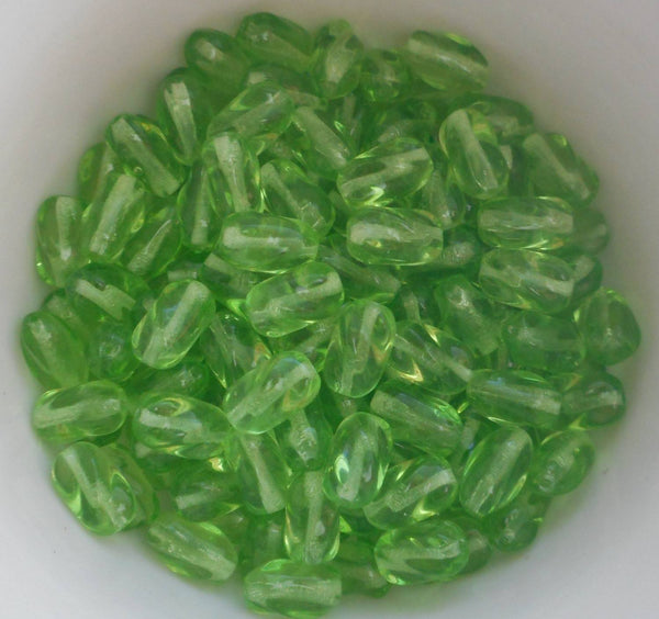 Lot of 25 9mm x 6mm Peridot Lime Green glass twisted oval beads, C0072