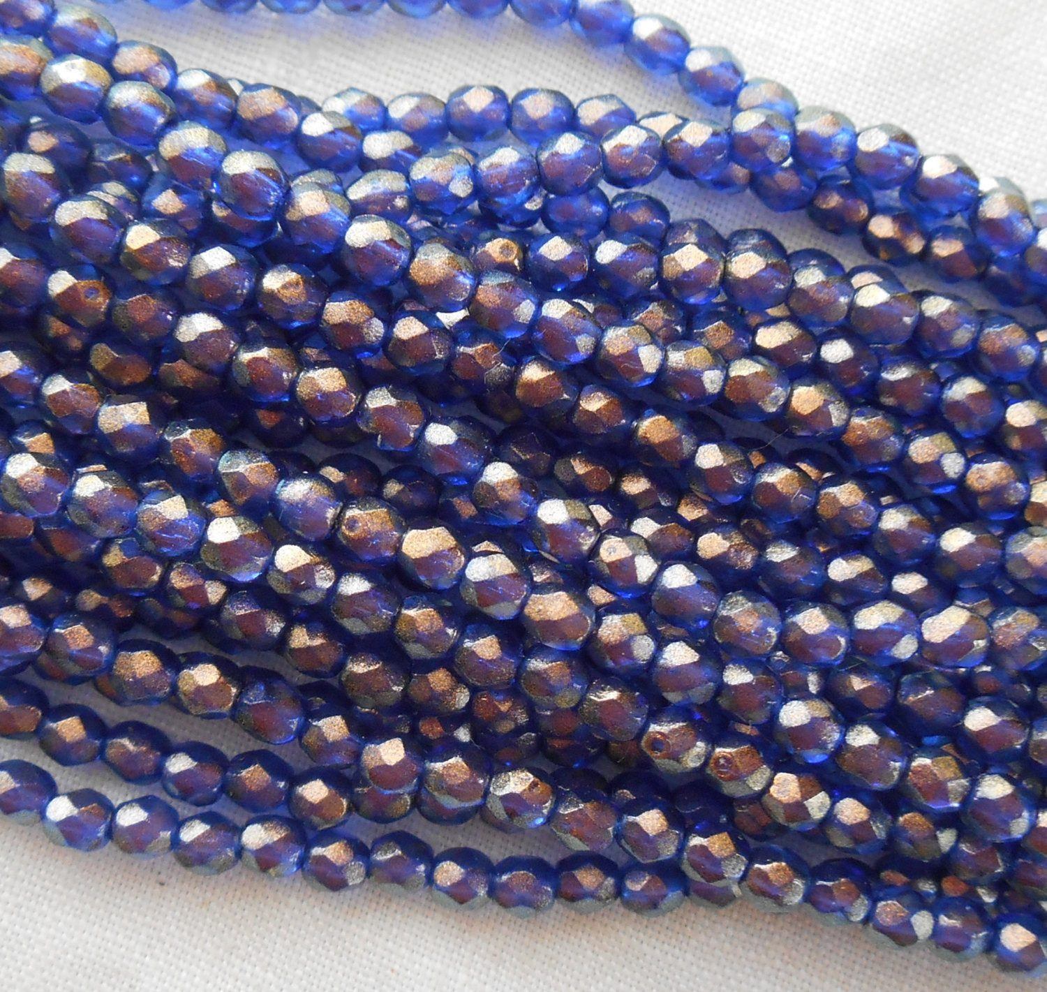 Fifty 3mm Halo Ultramarine Blue Czech glass over gold, firepolished, faceted round beads, C7750 - Glorious Glass Beads
