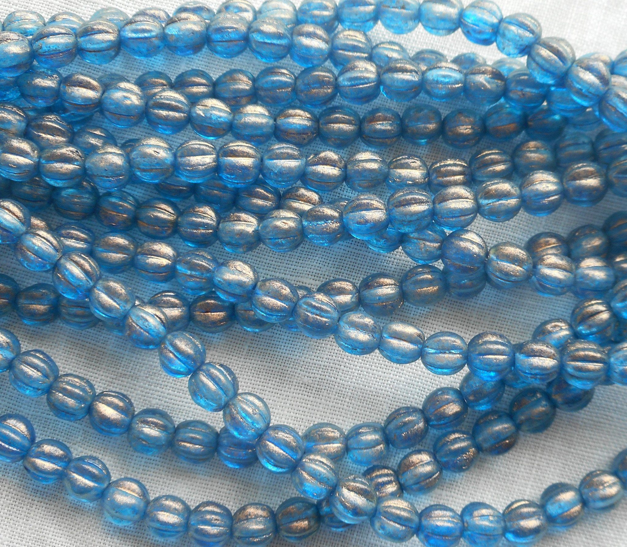 Fifty 5mm Halo Azurite blue melon beads, Pressed Czech glass beads C33150 - Glorious Glass Beads
