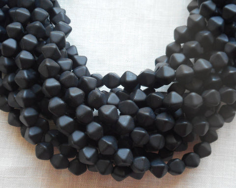 Fifty 6mm Matte Black bicones, pressed glass Czech bicone beads C7401 - Glorious Glass Beads