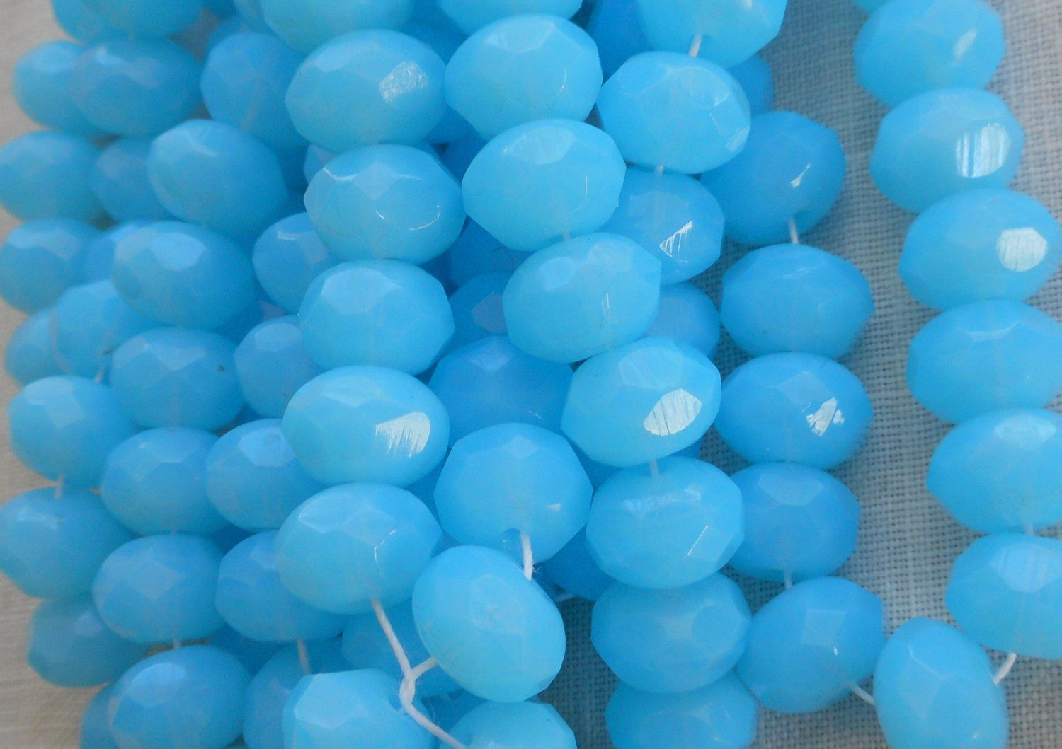 Lot of 25 6 x 9mm Opaque Milky Powder Blue faceted Czech glass puffy rondelle beads, C11125 - Glorious Glass Beads
