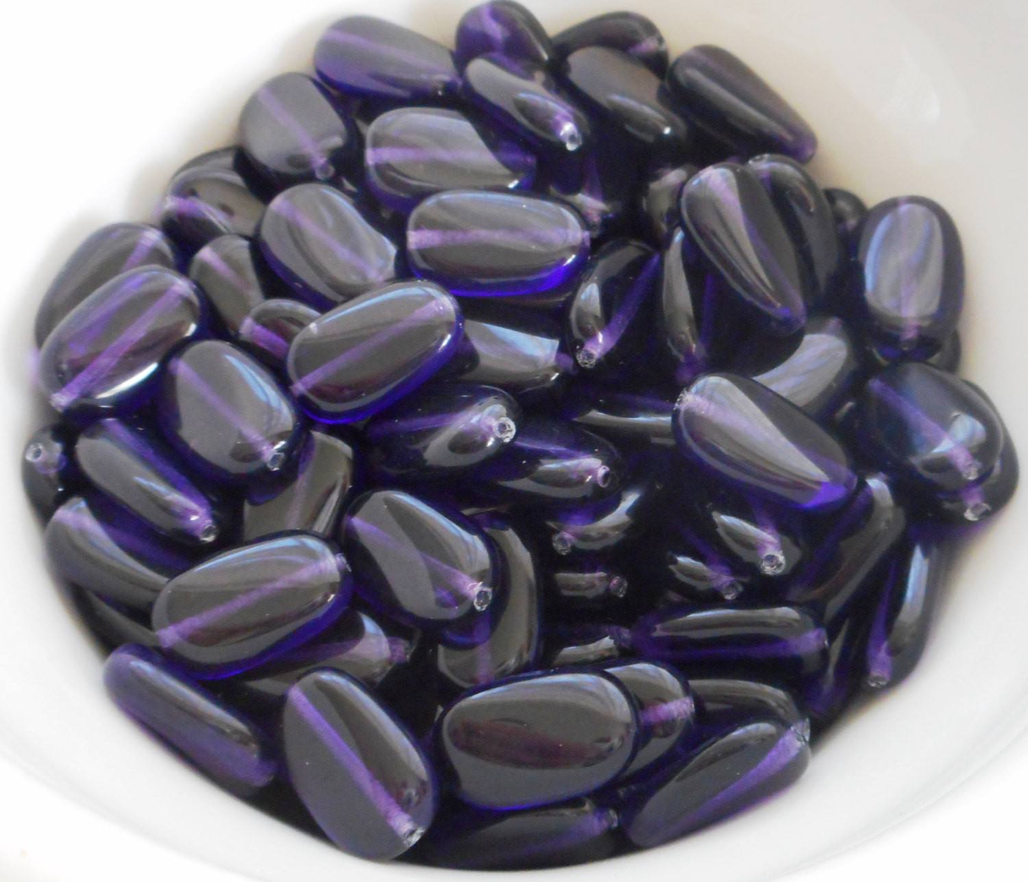 Lot of 25 Deep Violet, Purple, Amethyst slightly twisted oval Czech Glass beads, 14mm x 8mm pressed glass beads C6425 - Glorious Glass Beads